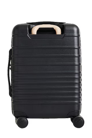 The Front-Pocket Carry-On Roller in Black | Revolve Clothing (Global)