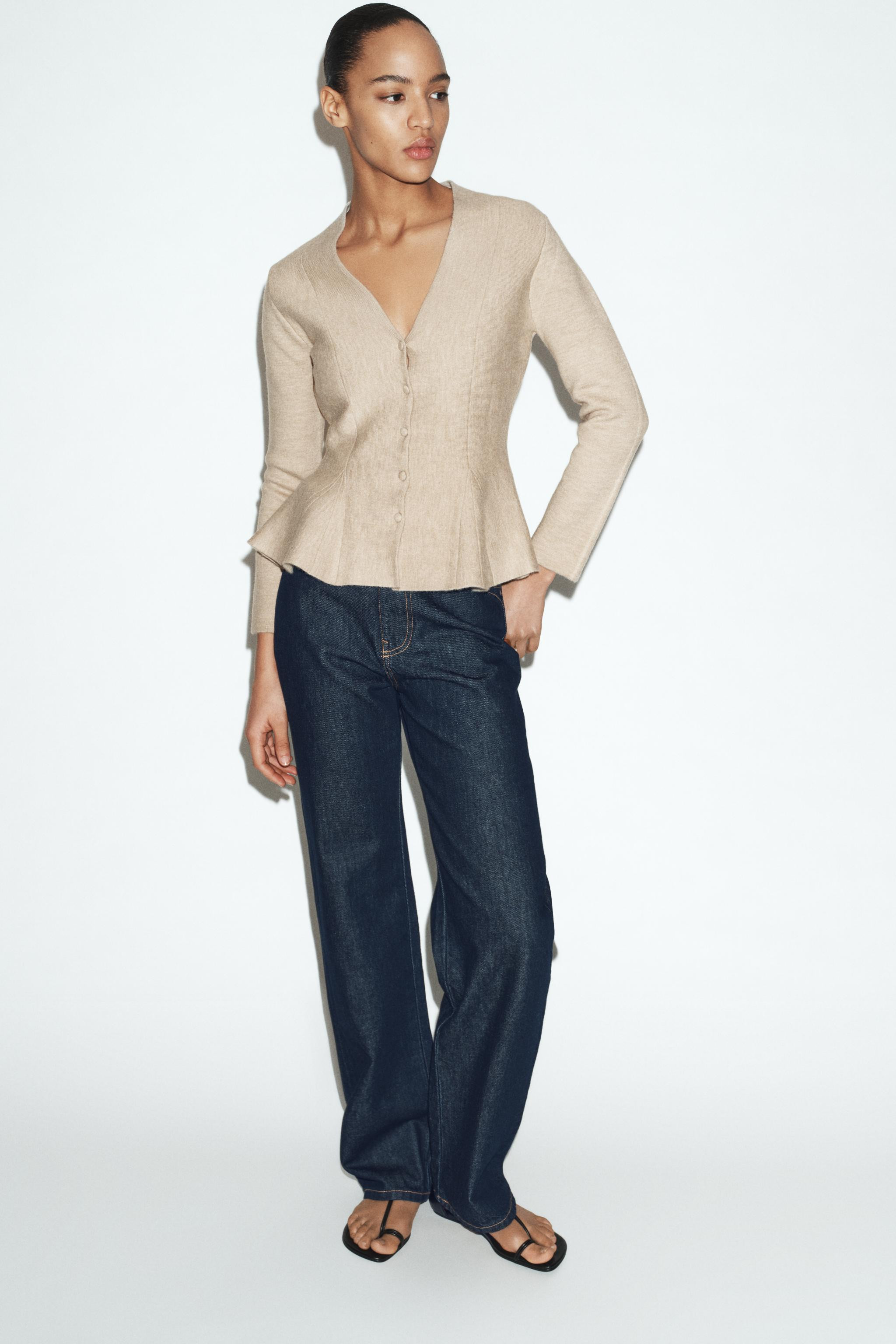 Fitted V-neck long sleeve jacket. Flared hem. Front closure with self-covered buttons. | Zara US