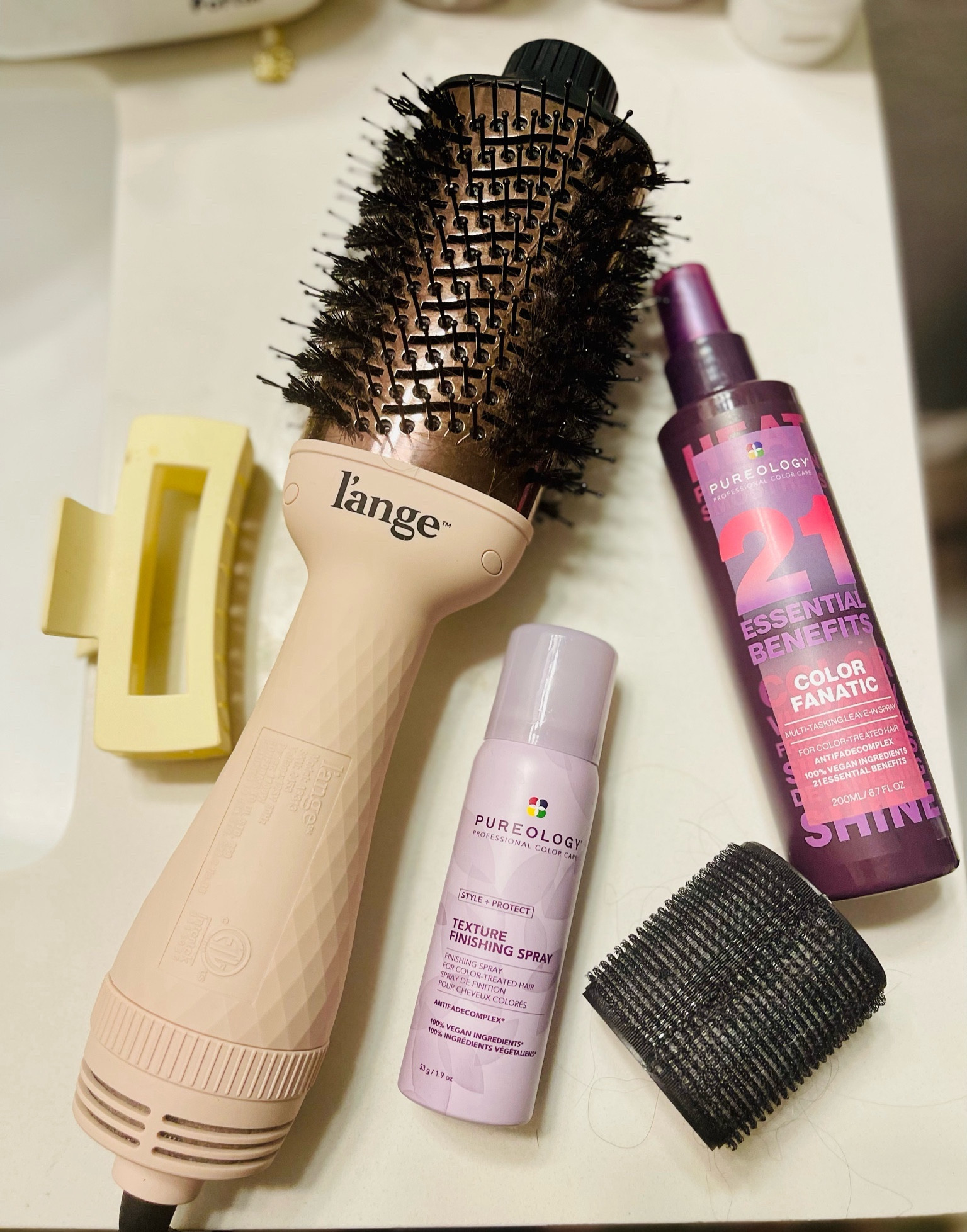 My go-to routine for the perfect blowout at home in under 30 minutes! 

My hair is super long and this Lange blow dry brush has been a life saver. I recently started using these Pureology hair styling products and absolutely love them. The Color Fanatic spray has 21 different benefits, but I use it most as leave in conditioner and heat protectant. The texture finishing spray goes on at the end. 

I use the Kitsch ceramic roller for my long bangs for an extra pop at the end. The XL claw clip holds my hair while I dry in sections.

Hair styling | long hair | blow dry brush | pureology | Lange | kitsch


#LTKfindsunder50 #LTKfindsunder100 #LTKbeauty