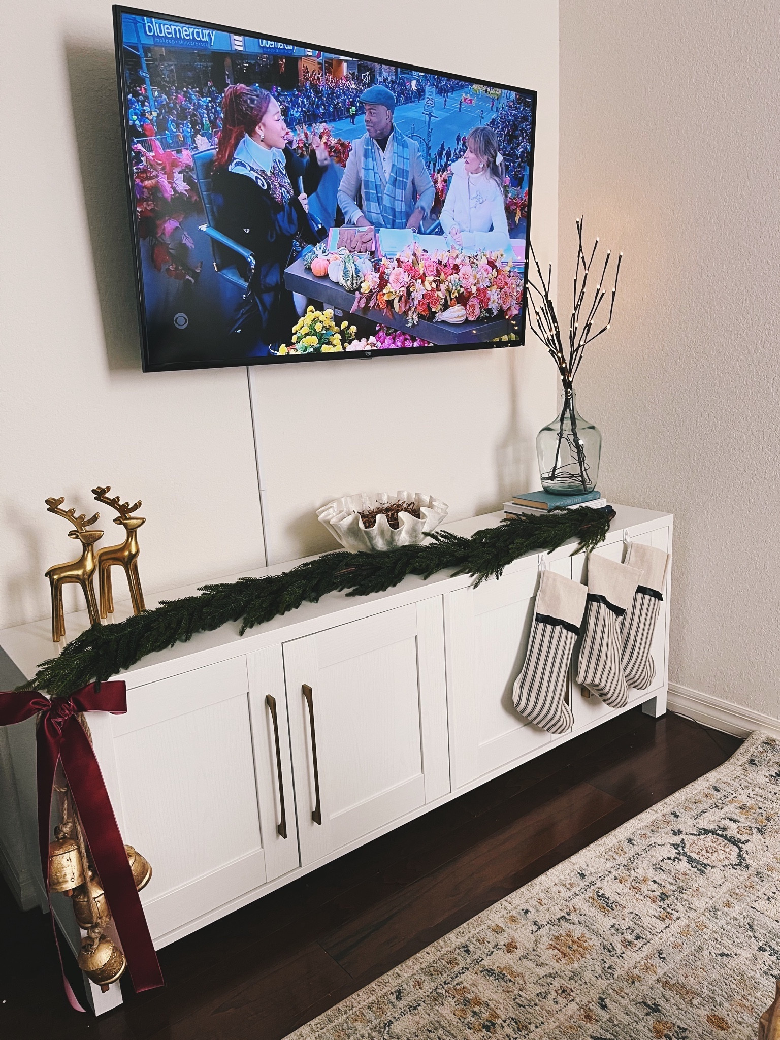 Thanksgiving morning🦃🤎 Started setting up for Christmas last night. Still have more decorations to put up!☺️ we don’t have a mantle in my townhouse, so I decorated my TV stand with stockings and a garland from Etsy. 

#LTKSeasonal #LTKhome #LTKHoliday