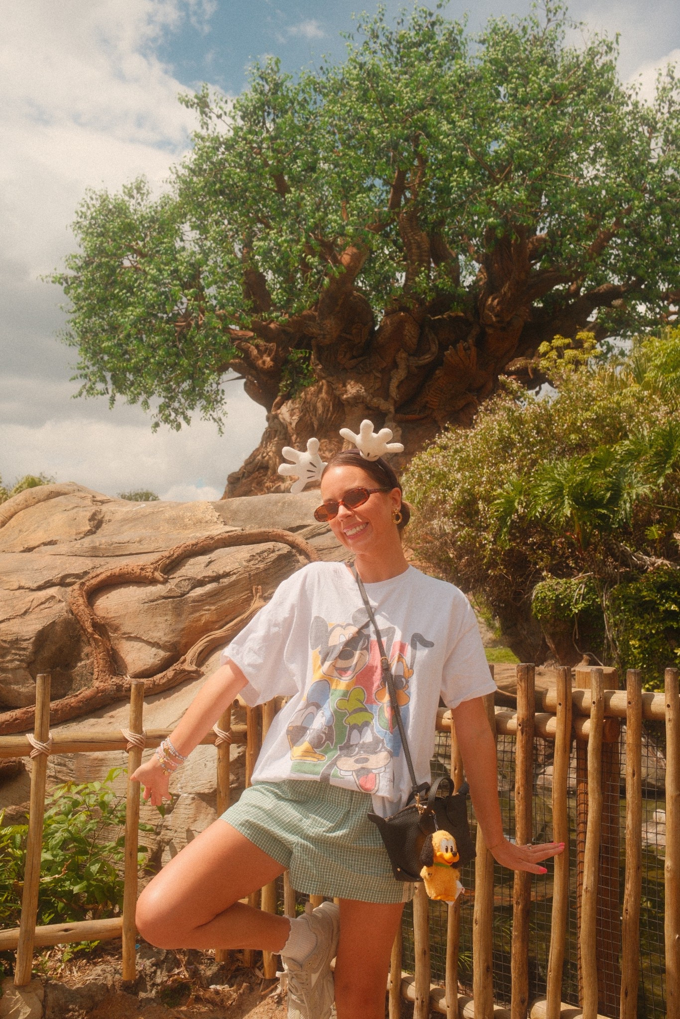 Comfy Disney ootd💚 shirt is from junkfood clothing!!! Disney outfit, Disney ideas, Disney Inspo, Disney parks, Disney style, Disney girl, Disney aesthetic, old navy gingham eyelet shorts, boxer shorts trend, Disney graphic tee, leather Stoney clover lane pouchette crossbody Disney bag, Disney accessories #Disney
