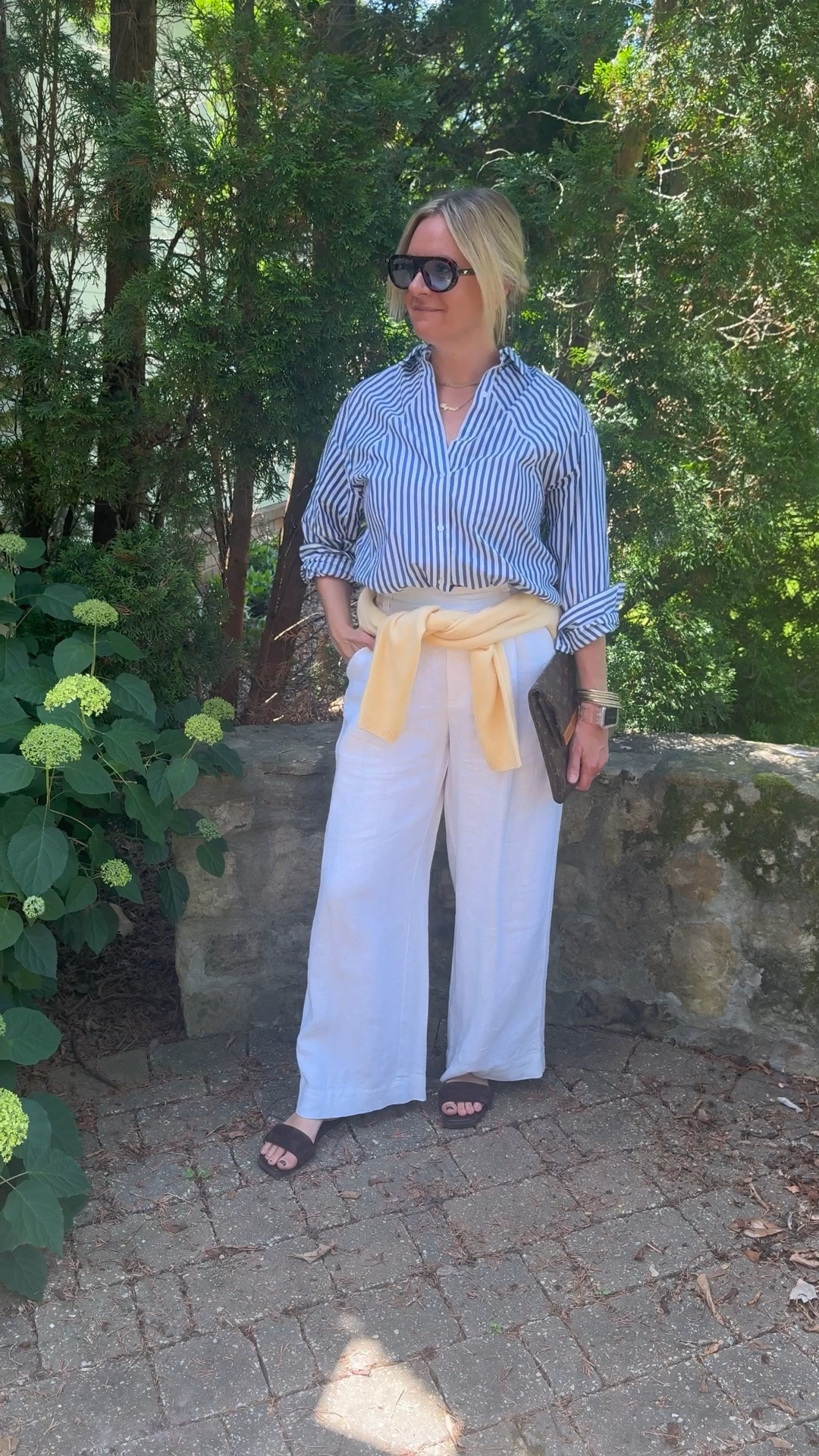 Unpopular opinion: a cardigan tied around your waist is a better styling move than a belt 👇

Here's why:

💛 It adds color without adding a separate accessory. A yellow cardigan tied at the waist does three things at once — it defines your waist, introduces a pop of color, and adds a layer you can actually use if it gets cool. A belt can only do one of those things.

💛 It makes a simple outfit look intentionally styled. Striped shirt + white linen pants is a great combination on its own. Add a tied cardigan and suddenly the whole look feels considered and put together in a way that's hard to explain but impossible to miss.

💛 It's the most versatile layering trick in your wardrobe. Any cardigan, any color, any outfit. Tie it loose for a relaxed vibe, knot it tighter for more definition. It works every single time and costs you nothing extra.

OOTD before heading out for a client personal shopping appointment ✨ Blue and white striped shirt + white wide leg linen pants + yellow cardigan tied at the waist + brown suede slide sandals + layered necklaces + blue lens sunglasses. All from my own closet — linked the closest versions I could find. Everything shoppable below! 👇

#LTKdayinmylife #LTKootd #LTKOver40
