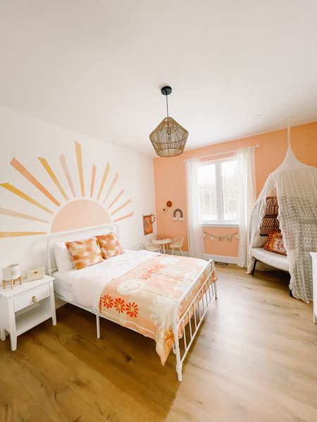 Peachy boho girls bedroom design, large sun wall mural, boho hippy room for girls

#LTKhome #LTKfamily #LTKkids