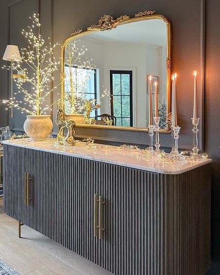Holiday sideboard decor ✨ 

fluted buffet, ornate vintage inspired mirror, lit LED gold tree, gold lit garland, Amazon, Target, Arhaus Finnley 

#LTKHoliday #LTKhome #LTKstyletip