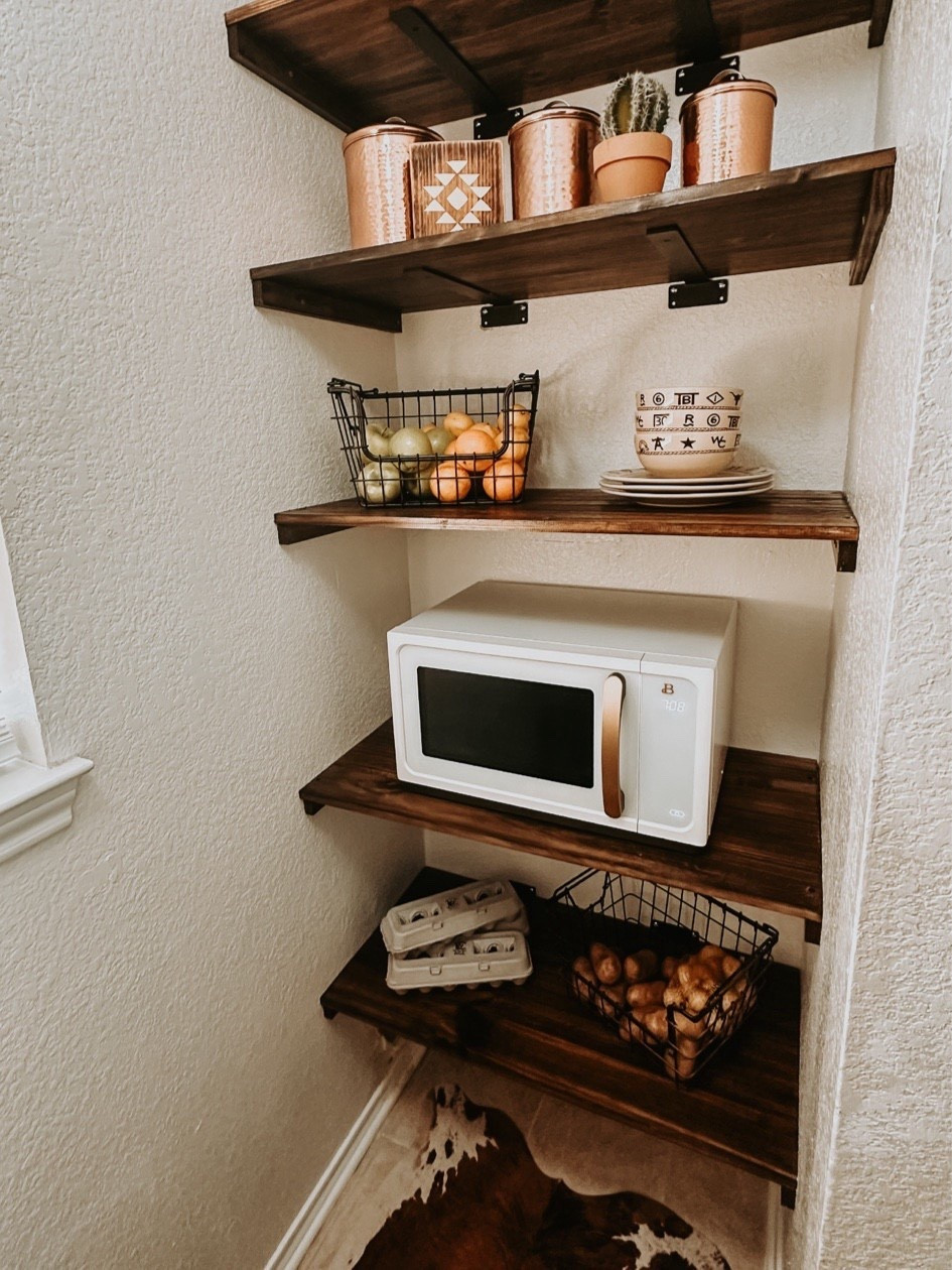DIY Western Pantry in our small ranch house. This area used to be the “dryer” space. Small huh??? For those of y’all that are new, our house is only 1,017 sq ft 😱 if you’re asking how our kids live here…..they just do. It’s a home. To much surprise is has bedrooms 😂😂😂 

We converted our small but might “laundry area” into an open pantry with enough room for a microwave (I know, how horrible….sue me) 

I love how these shelves turned out much thanks to my handy hubby! Brackets were purchased on #amazon ! 


#countryliving #ranchhouse #smallhouse #smallhome #amazonassociate

#LTKHome