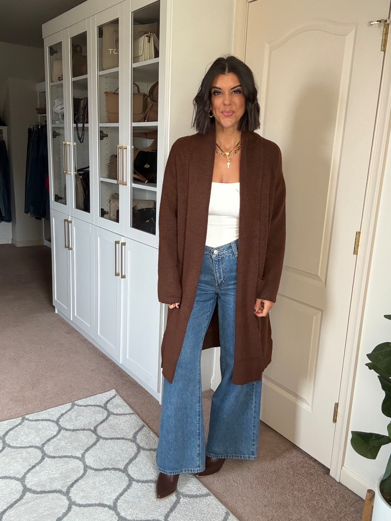 Size small in cardigan and tank size 2 in Levi jeans boots tts

#LTKSeasonal #LTKFindsUnder100