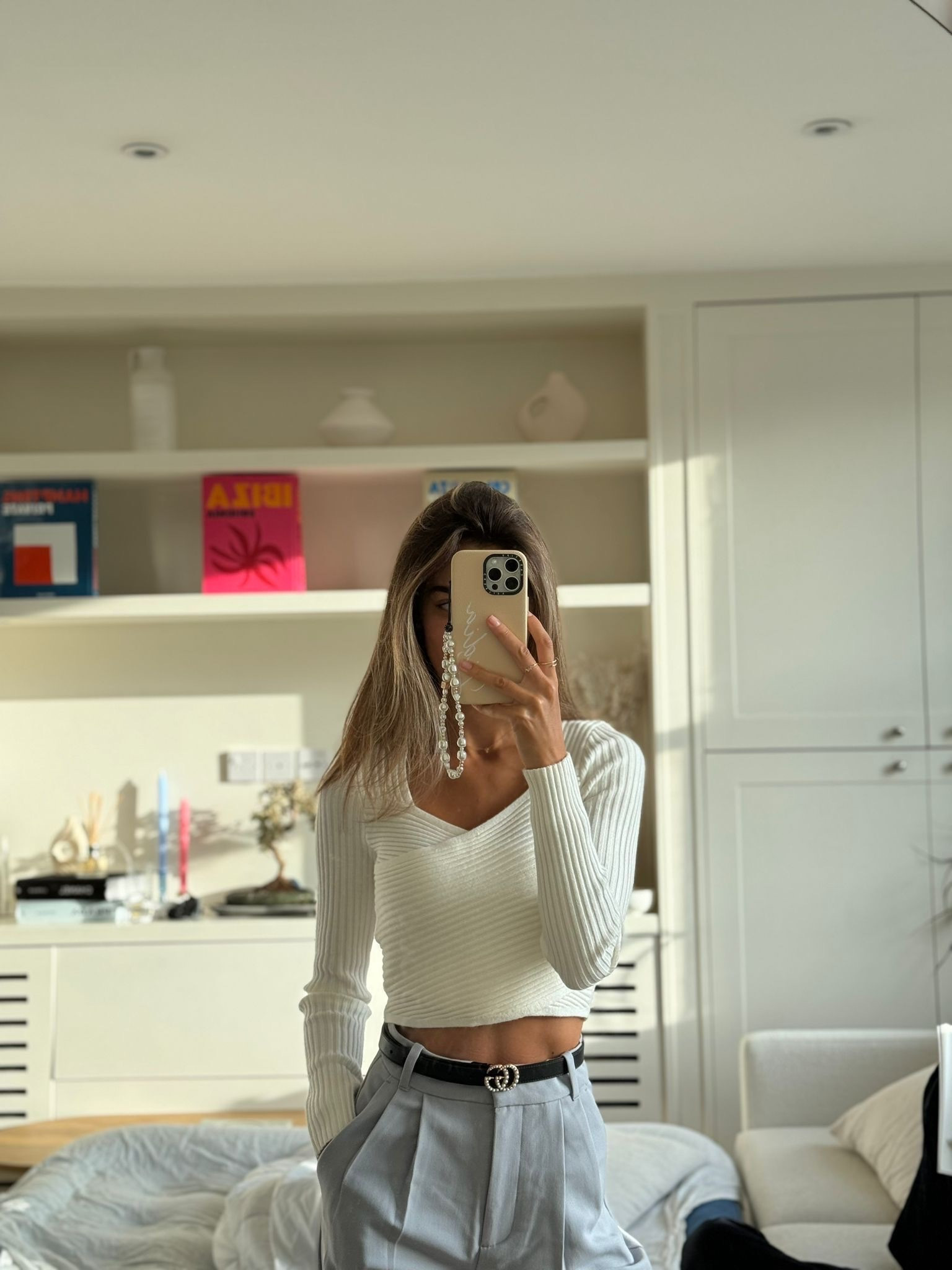 Cream knitted top, long sleeve white crop top, grey tailors trousers, thin black belt, Gucci, Abercrombie 

#LTKeurope #LTKstyletip #LTKSeasonal