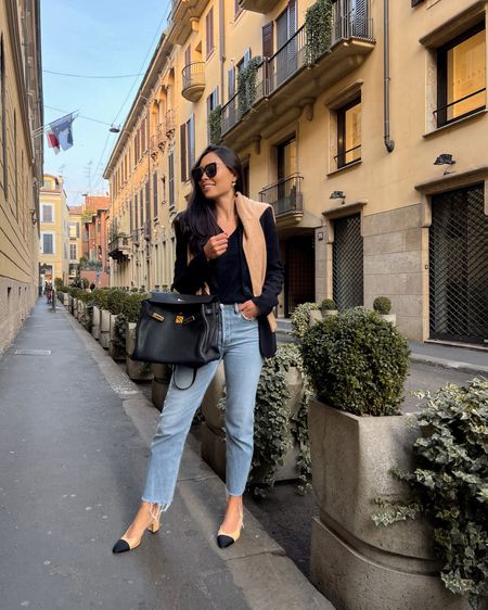 Kat Jamieson wears jeans, a black blazer, cashmere sweater, Hermes bag and Chanel sling back heels in Milan. Casual style, neutrals, workwear, denim, ballet flats. 

#LTKshoecrush #LTKSeasonal #LTKitbag