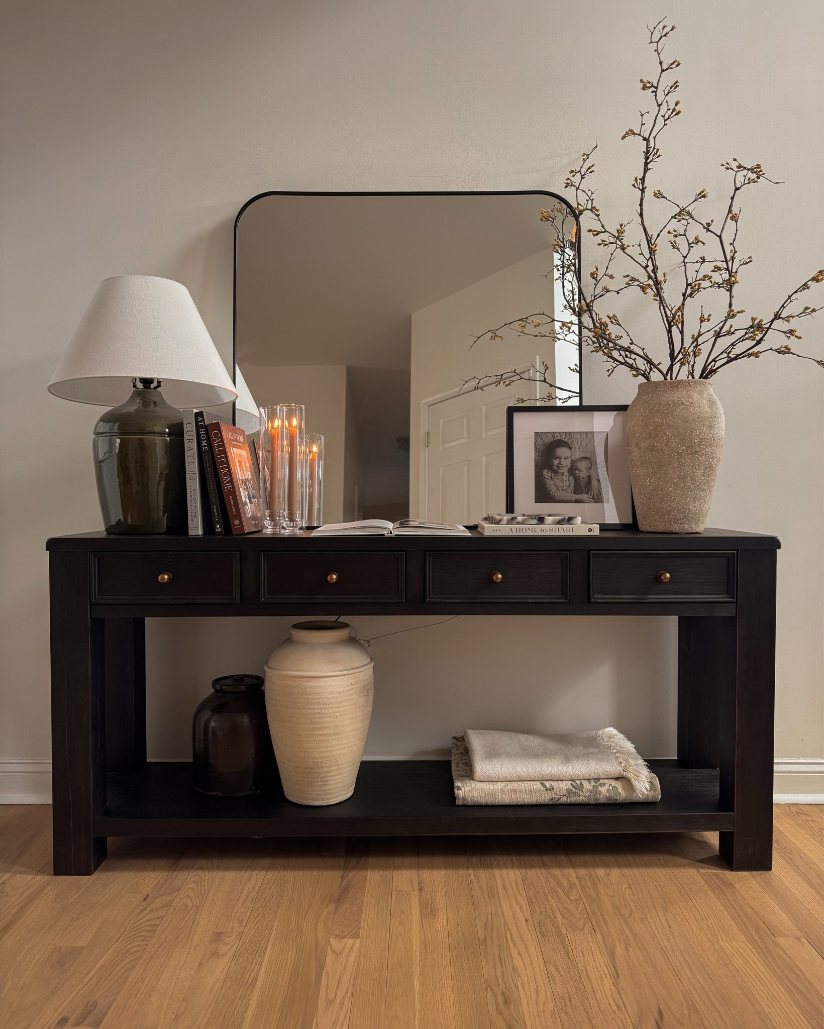 Spring decor, spring entryway decor, console table styling, table lamp, entryway mirror, entryway console table, vase, spring stems, throw blankets

#LTKHome