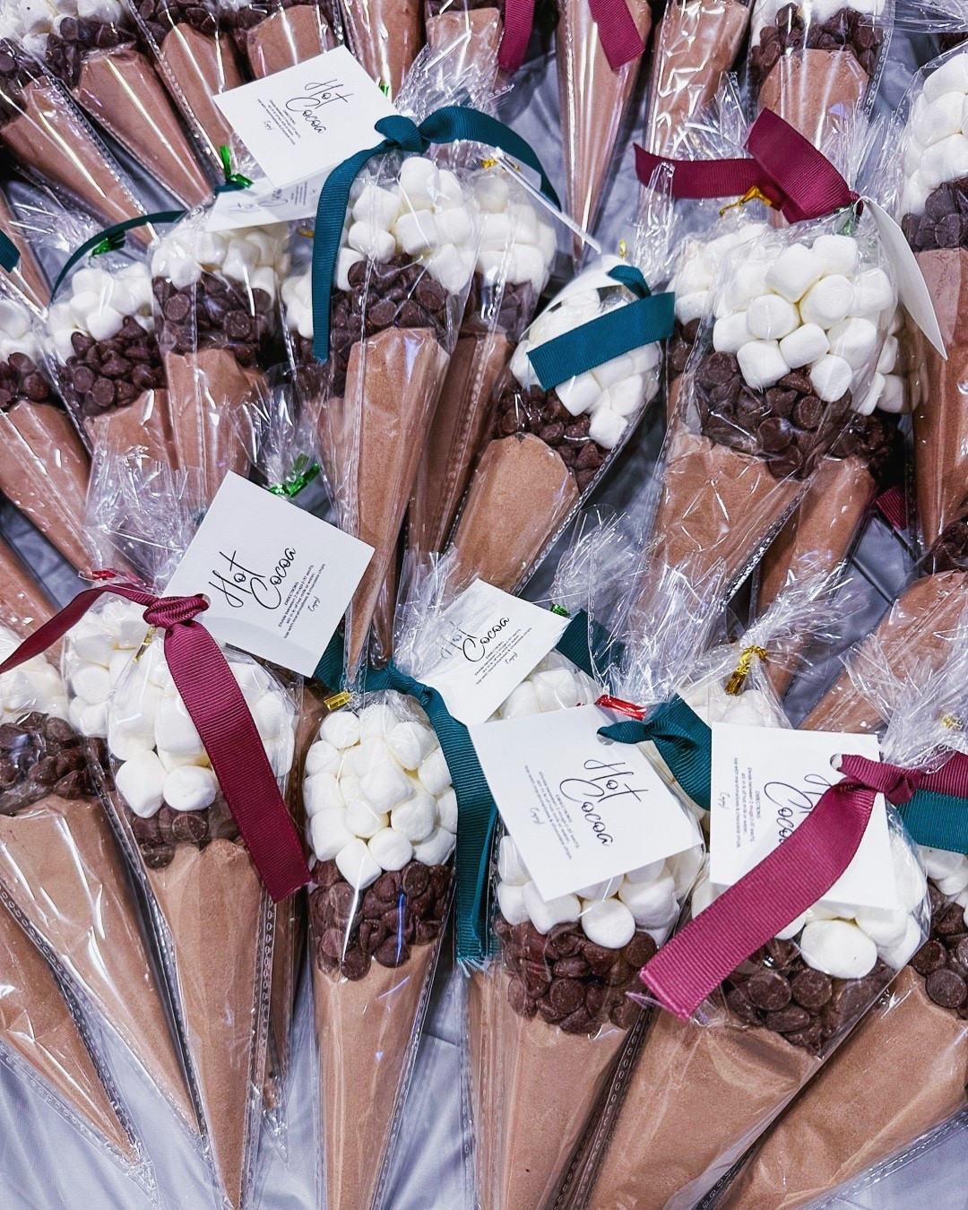 Hot cocoa cones!  Quick, easy & budget-friendly gift idea.  Simple, sweet, and perfect for anyone.  All you need: plastic sleeves, hot cocoa powder, marshmallows & chocolate chips.  


#LTKGiftGuide #LTKSeasonal #LTKHoliday