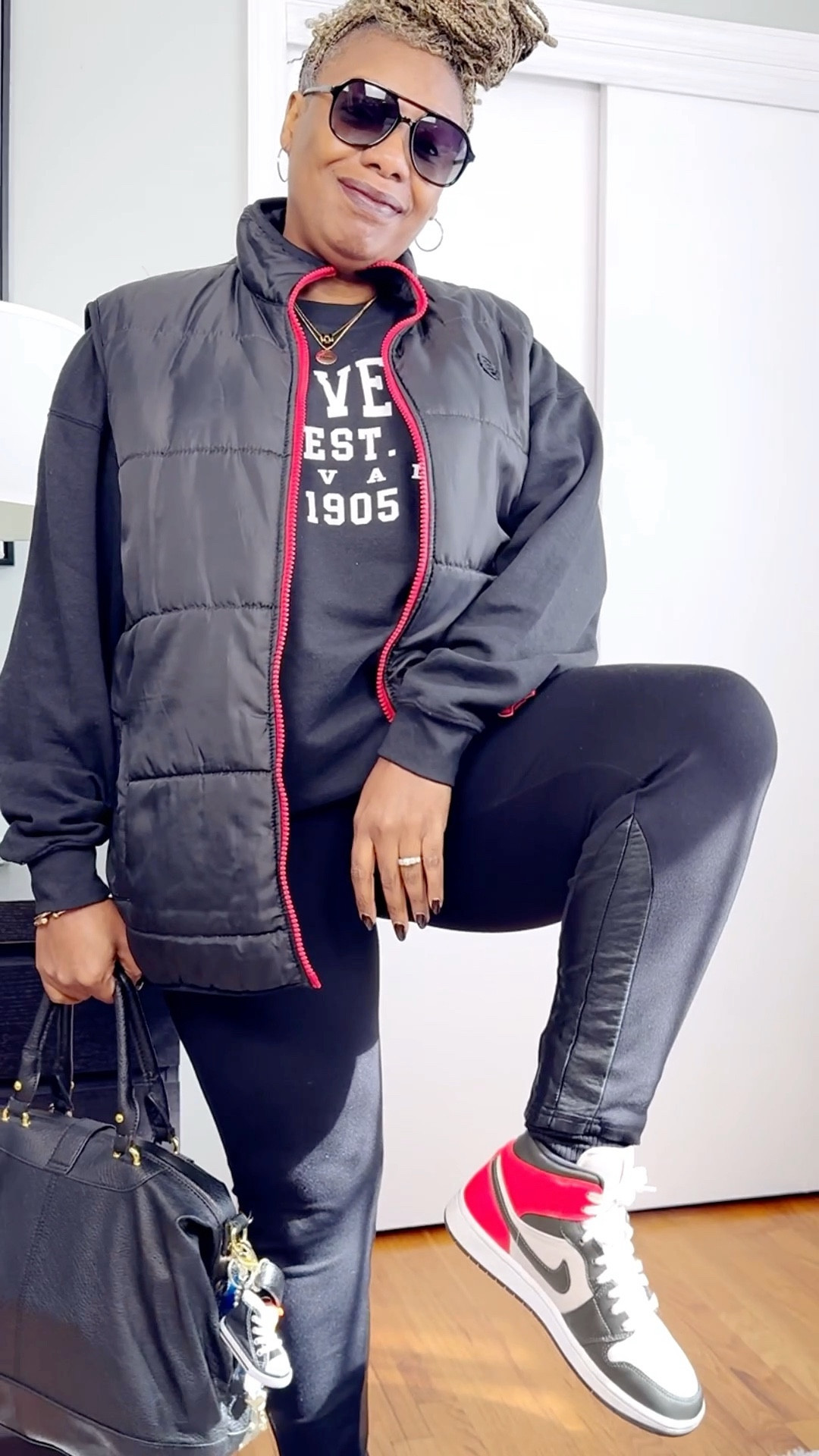 Outfits by Miki | Regular Degular 05 | Sporty Chic Layers
Black puffer vest + graphic sweatshirt + leggings = easy weekend formula. Finished with my go-to Jordans and a structured tote. Simple, sporty, and smart — proof you can stay cozy and still serve. 🖤 

#fallfashion #athleisure #casualstyle #everydayfashion #streetstyle #midsizestyle #neutralstyle #comfychic

#LTKOver40 #LTKMidsize #LTKStyleTip