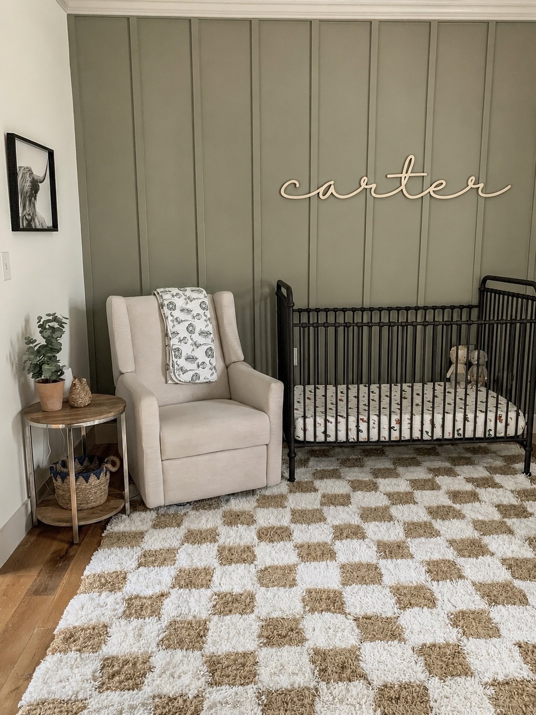 Personalized nursery name signs are the perfect finishing touch for a cozy, modern baby room. This custom wooden name sign adds a soft, timeless detail above the crib and makes the nursery feel warm, personal, and complete.

Shown here in a neutral baby boy nursery with an olive green board and batten accent wall, black crib, cozy rocking chair, and modern farmhouse decor. Each name sign is custom made to order and designed to be lightweight, simple to hang, and beautiful for nursery walls, kids rooms, baby shower gifts, and newborn photo backdrops.

Perfect for:

* Nursery wall decor
* Baby name signs
* Crib wall decor
* Personalized baby gifts
* Baby shower gifts
* Modern farmhouse nursery decor
* Neutral nursery decor
* Boy nursery decor
* Girl nursery decor
* Kids room wall decor

Custom sizing and font options available.

#LTKmomlife #LTKBaby #LTKBump