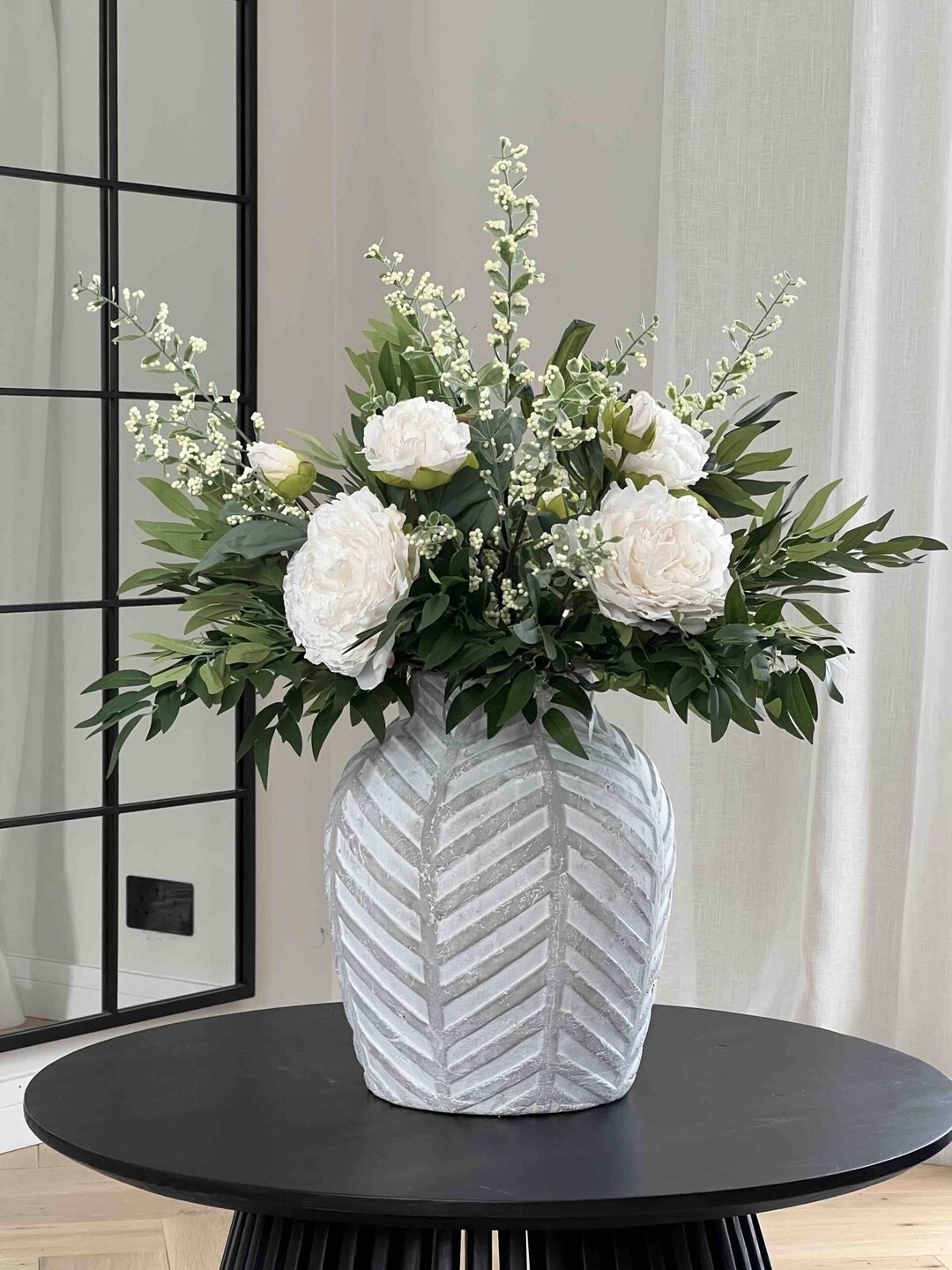 Classic, timeless, and effortlessly elegant 🤍🌿 This Ruscus and Peony Faux Flower Arrangement by KissMyPampas is a true statement piece, blending silk peonies with ruscus greenery and soft white berries for a beautifully balanced white-and-green palette. The dried-look florals add depth and texture, making it perfect for elevating living spaces, entryways, or event styling with zero maintenance and year-round beauty.

#LTKhome #LTKdecor #FauxFlowers #NeutralDecor #WhiteAndGreen #TimelessStyle #EtsyFinds #HomeInspo

#LTKWedding #LTKHome #LTKSeasonal