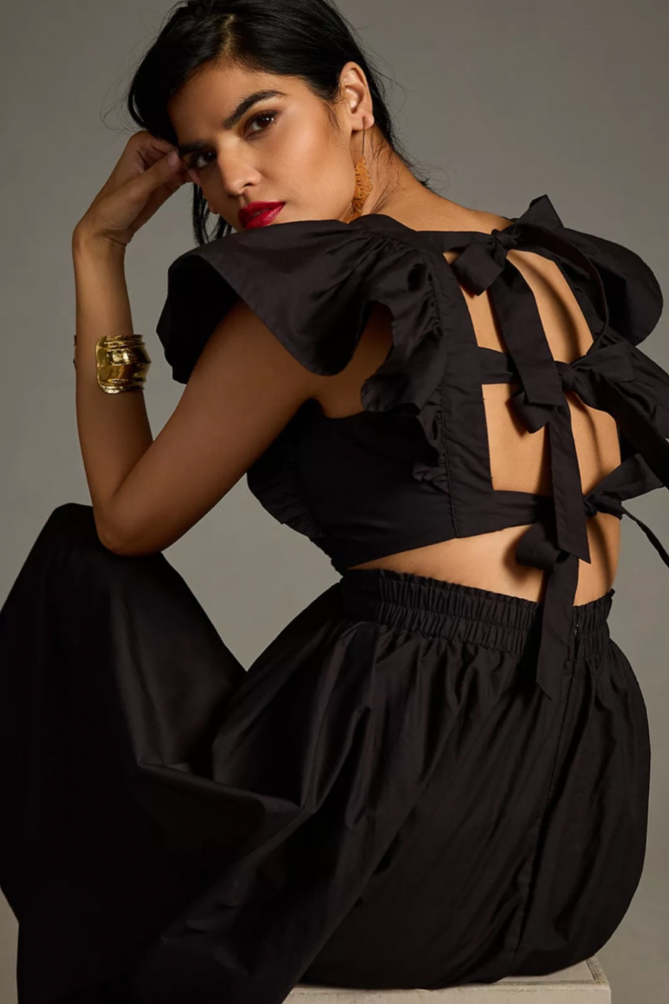 Cute black dress with ruffle sleeves and bow detail in the back. So cute as a wedding guest dress or just a special little black dress for the summer!

#LTKwedding #LTKsalealert #LTKxAnthro