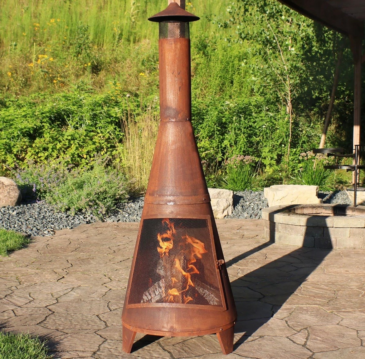 70'' H x 23.5'' W 70" Rust Patina Finish Steel Wood-Burning Chiminea with Spark Screen

#LTKHome #LTKSaleAlert #LTKPetite