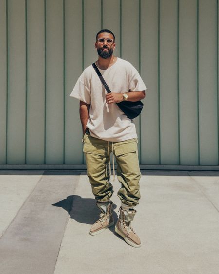 FEAR OF GOD Inside Out Shirt in ‘Sand’ (size M), Military Cargo pants in ‘Military Green’ (size M), Sock in ‘Cream’, and Boat Hi Boots in ‘Daino’ (size 42). THE ROW Slouchy Banana Bag in ‘Black’. FEAR OF GOD x BARTON PERREIRA glasses. A relaxed and elevated men’s look that is comfortable and easy to wear to lunch or a night out. An edgy army inspired look, featuring my go-to crossbody bag.

#LTKmens #LTKstyletip