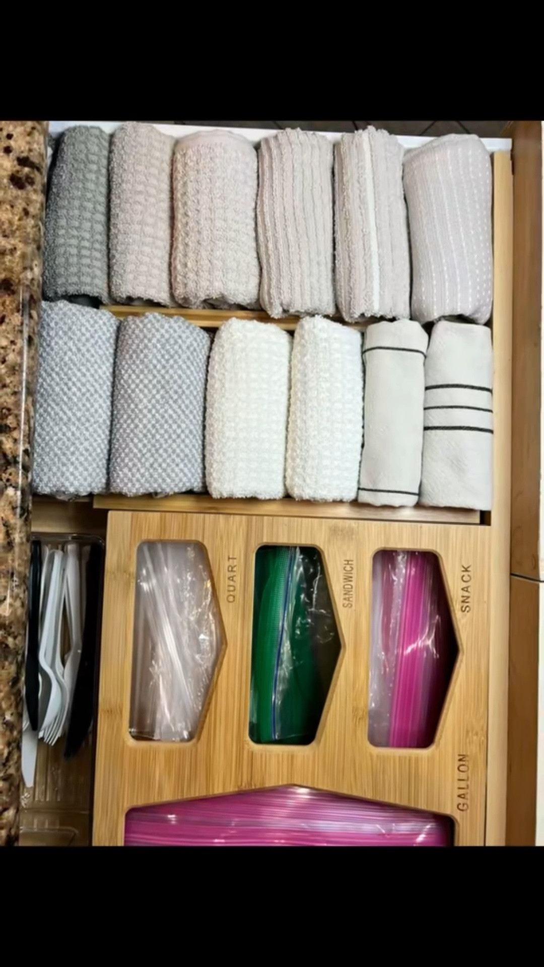 
I use a bamboo organizer to keep Ziploc bags contained, and expandable bamboo drawer dividers to stack hand towels so they stay put. Simple systems that are easy to maintain.

#LTKHome