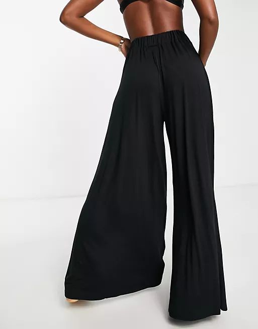 ASOS DESIGN jersey palazzo beach pants in black | ASOS (Global)