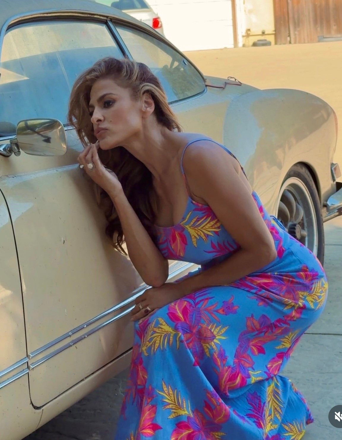 Eva Mendes' printed surf maxi dress, featuring a sleeveless cut and a square neckline for breathable comfort and a clean, structured look. Strap closure ensures a secure fit while maintaining effortless wearability.