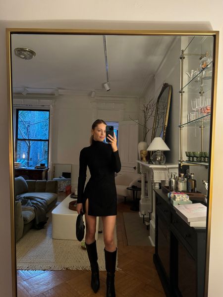 Favorite black mini dress and boots combo 