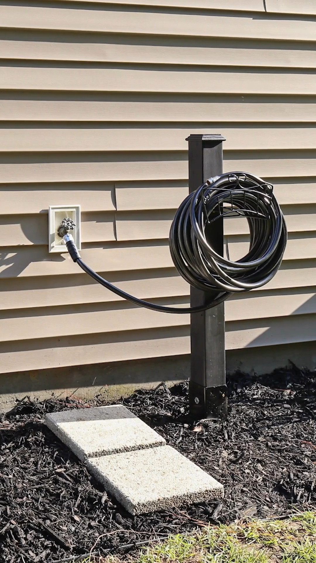 DIY hose stand with a retractable garden hose reel and a Neverkink hose from @loweshomeimprovement 

#LTKHome