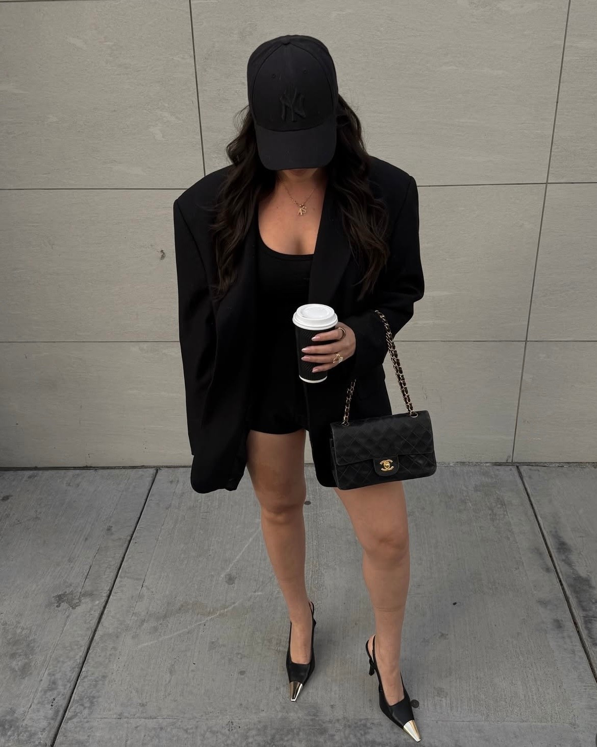 Chic black blazer and kitten heels outfit for spring styled with a black purse and baseball cap 

#LTKootd #LTKSeasonal