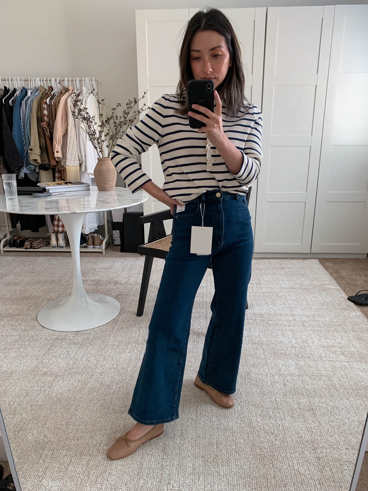 DL1961 Hepburn High Waist Ankle Wide Leg Jeans. Amazing wide legged jeans for petites. Snug, but stretchy. Take your normal size. 

Top - Sezane small
Jeans - DL1961 23. But need the 24 my normal size. 
Flats - Mansur Gavriel 35