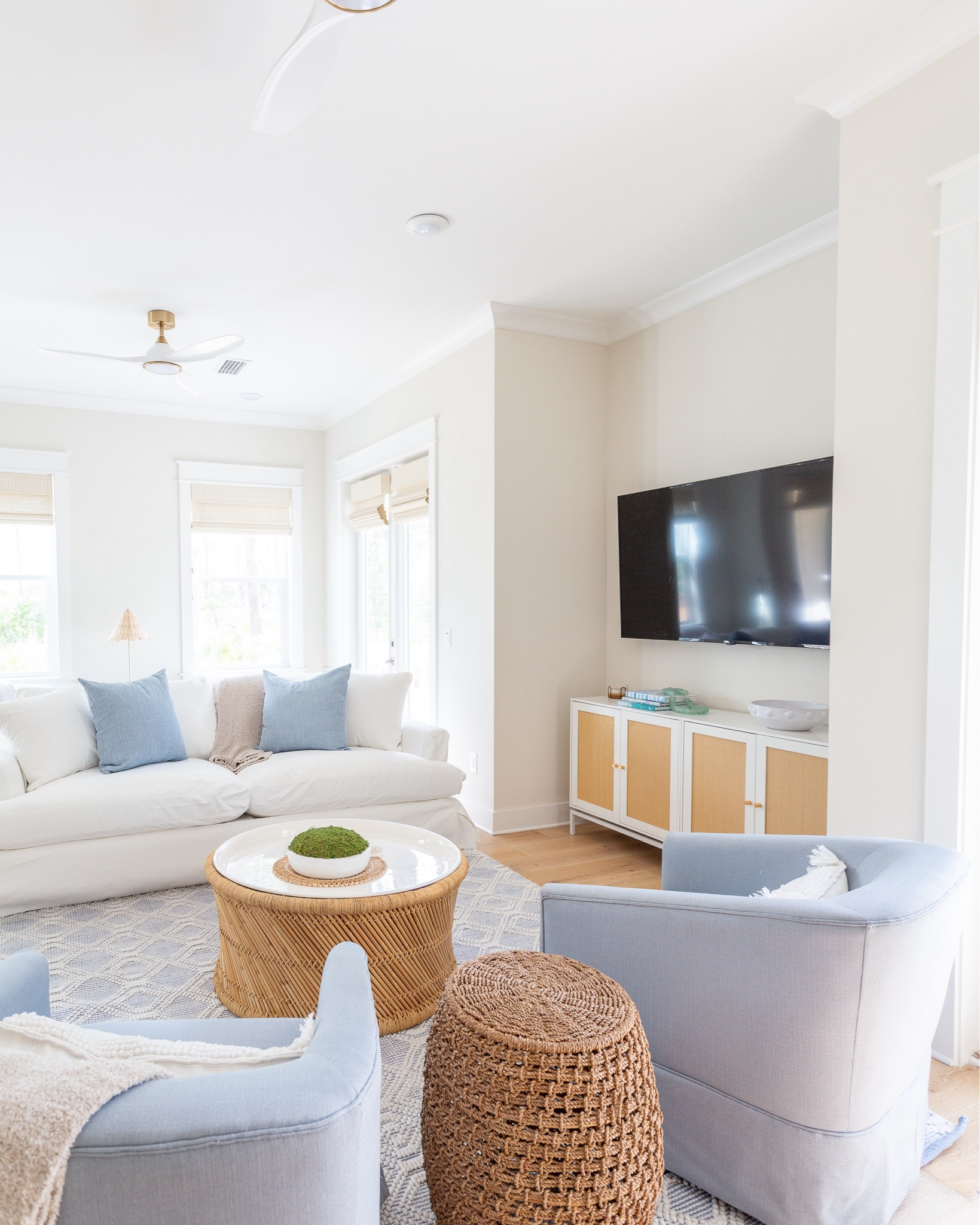 The living room at Hola Beaches Casita, our latest 30A vacation rental, has so many great designer looks for less! This slipcovered sofa is fully washable. These light blue swivel armchairs, woven blue rug, bamboo storage coffee table, rattan style media cabinet and white and gold ceiling fan all add the perfect coastal vibes! See more pics and take the full home tour here: https://lifeonvirginiastreet.com/hola-beaches-casita-30a-tour/.
.
#ltkhome #ltksalealert #ltkseasonal #ltkstyletip #ltkfindsunder50 #ltkfindsunder100 #ltktravel

#LTKxWalmart #LTKHome #LTKSaleAlert