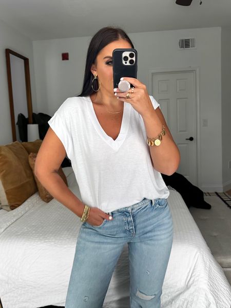 Express Supersoft Linen-Blend Skimming V-Neck Tee wearing size medium $34. Express Mid Rise Light Wash Ripped 70s Flare jeans wearing size 6 $88. 
