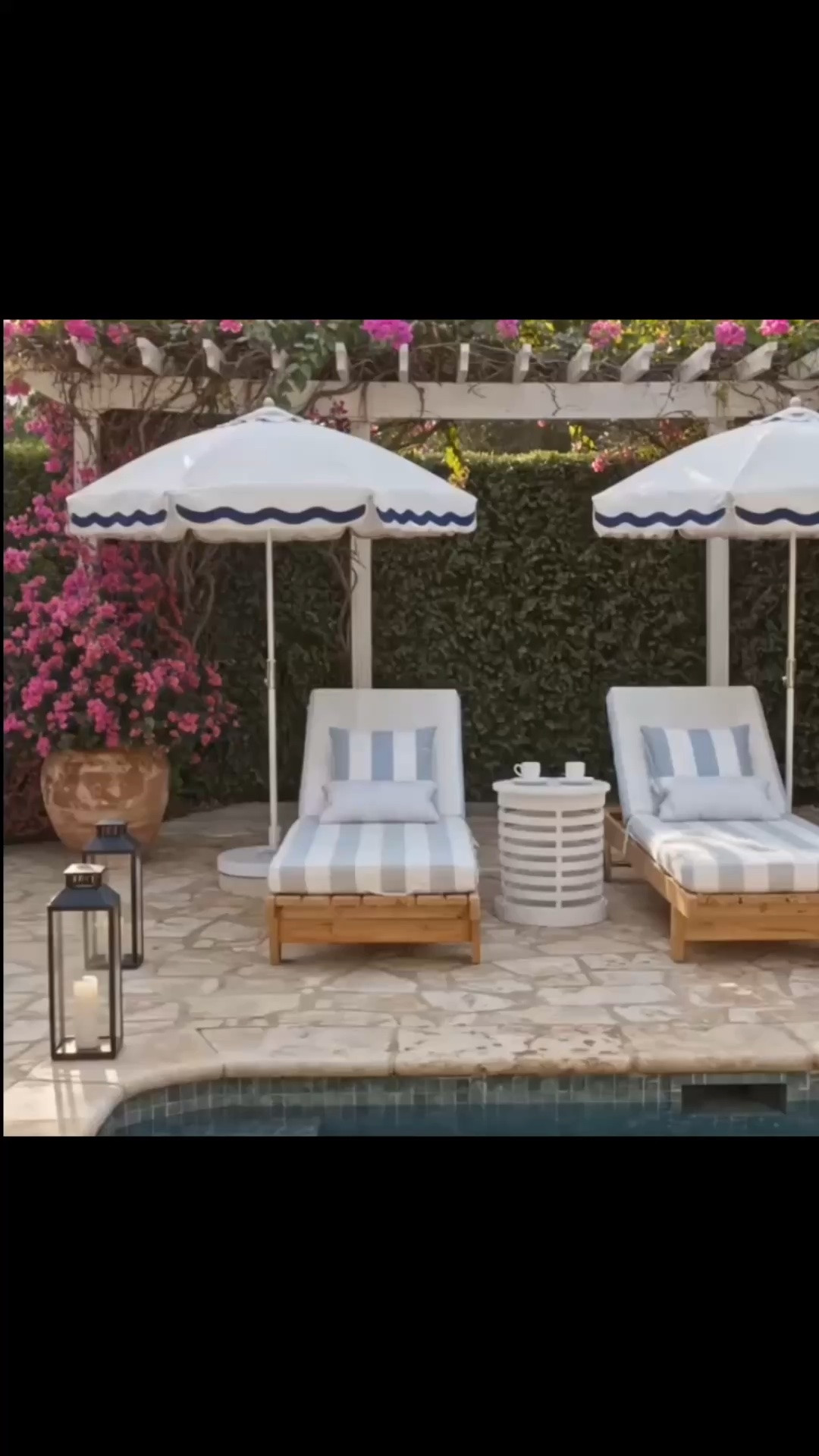 Summer is all about beautiful poolside moments—sunshine, cool water, and a relaxing place to lounge all afternoon. ☀️

Scalloped outdoor umbrellas, striped chaise lounge chairs, soft outdoor pillows, a sculptural side table, and lanterns create an elegant resort-inspired setting right at home. The crisp blue-and-white palette feels timeless, while the natural wood and surrounding greenery bring warmth to this dreamy summer retreat.

Shop the Serena & Lily Outdoor Sale—up to 40% off.

#SerenaAndLily #OutdoorLiving #PoolsideStyle #PoolsideDecor #OutdoorUmbrella #ScallopedUmbrella #OutdoorChair #OutdoorChaise #ChaiseLounge #OutdoorLoungeChair #OutdoorTable #OutdoorSideTable #OutdoorPillows #OutdoorLantern #PatioDecor #CoastalStyle #SummerStyle #SerenaAndLilySale

#LTKdayinmylife #LTKHome #LTKSaleAlert