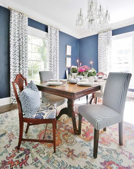 Fall dining room decor. Blue and white dining room with blue and white pumpkins and blue and white striped chairs and a colorful rug.

#LTKSeasonal #LTKhome #LTKunder100