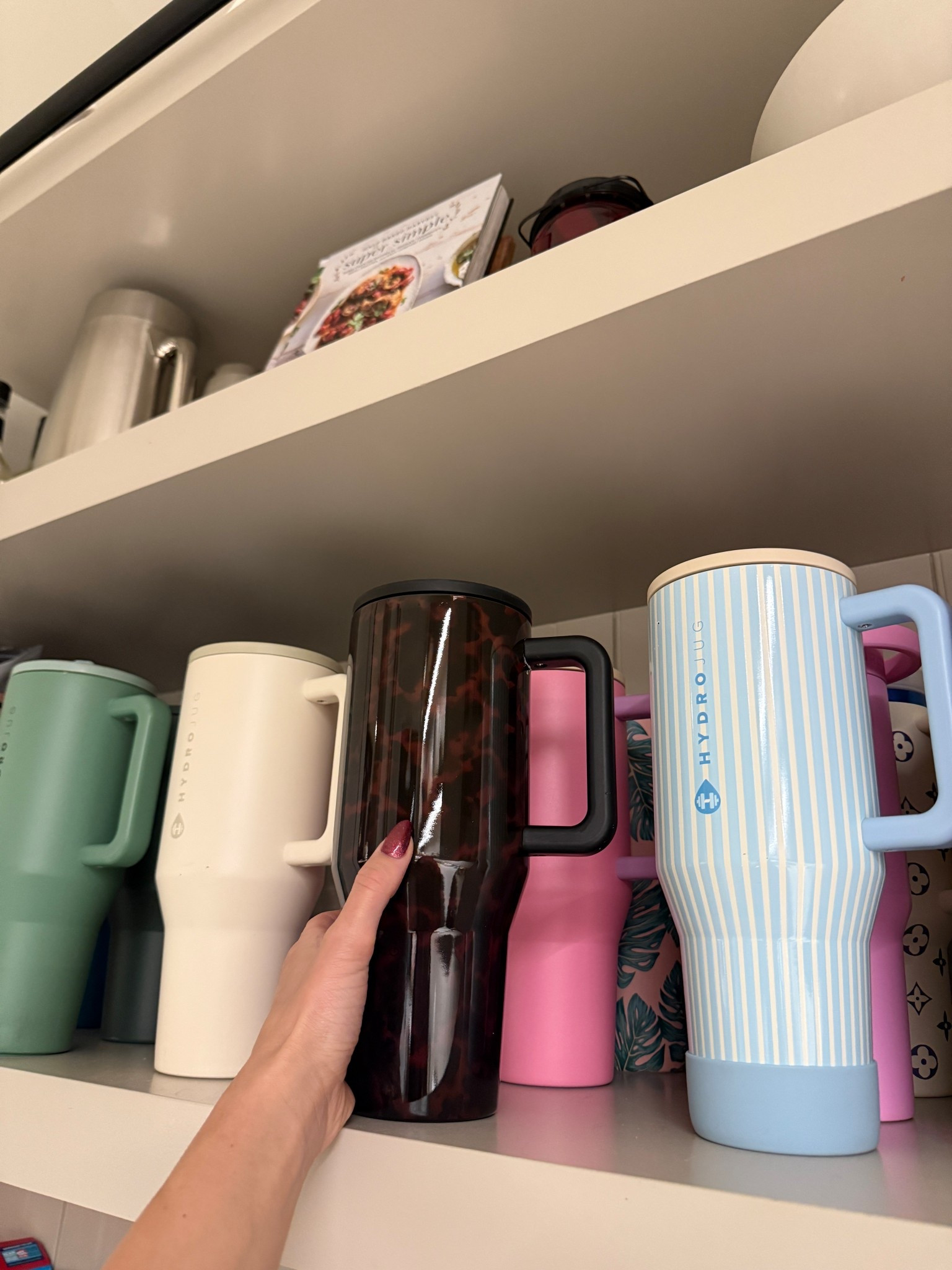 This exact Hydrojug Traveler is no longer available but there are so many colors and patterns to choose from! Every style has a spill proof lid. They are the best!

#LTKActive #LTKHome