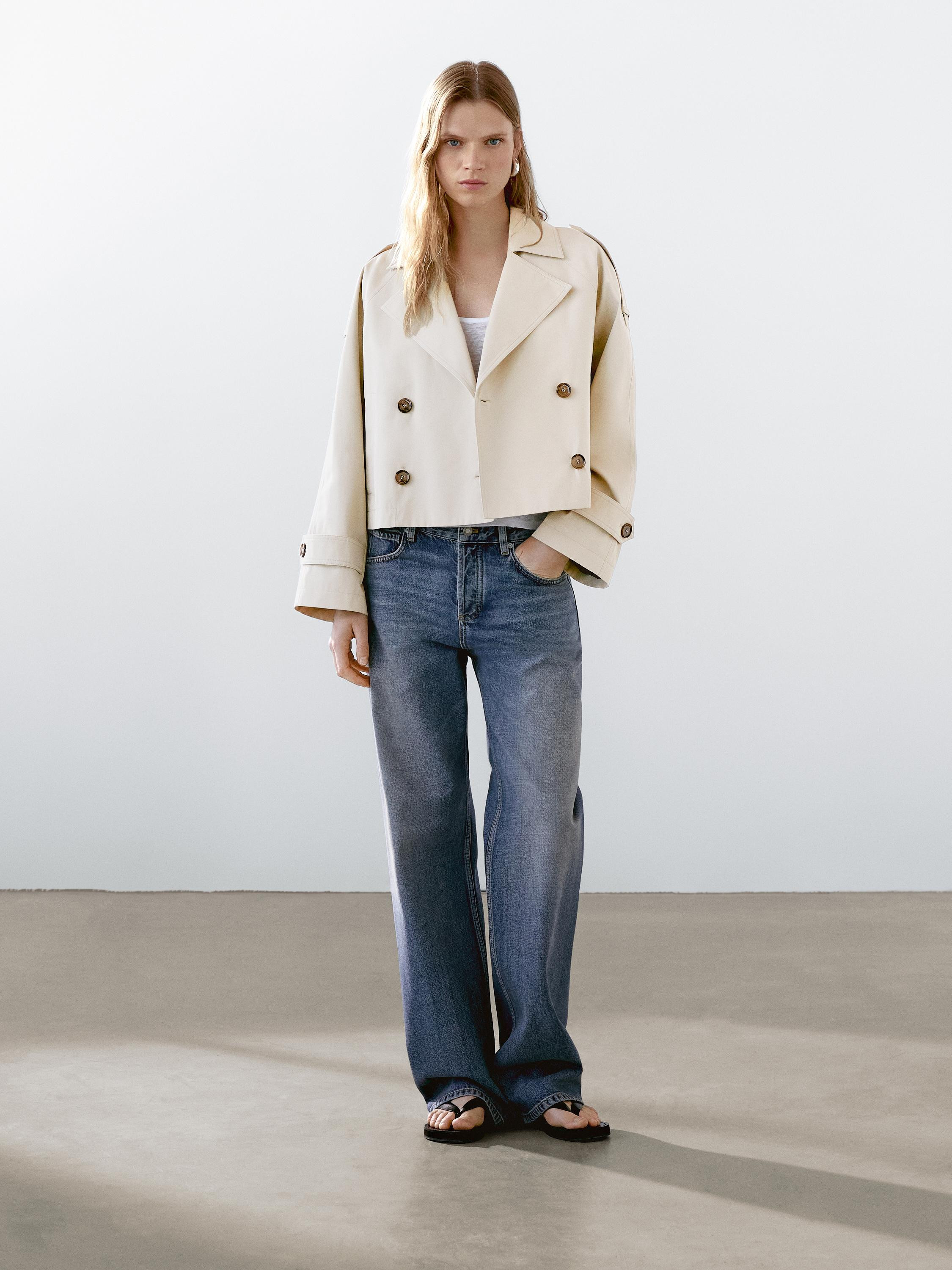 Trench coat with notch lapel and grommet . Cuffs with buttoned tab. Double-breasted button fasten... | Massimo Dutti US