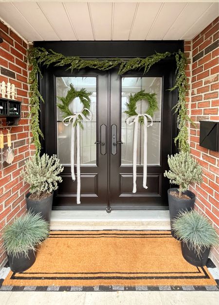 Our front door porch looks so elegant and festive! I love decorating this spot for any holiday but I think Christmas is my favourite. Just a touch of festive air before you enter the house!

Wreaths, front door decor, Christmas decorating, double door decor

#LTKSeasonal #LTKhome #LTKHoliday
