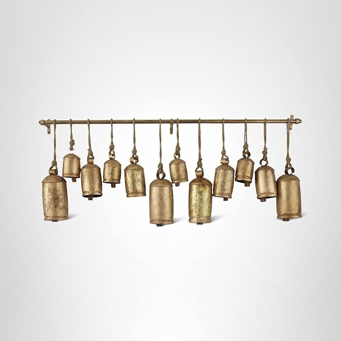 Deco 79 Metal Decorative Cow Bells Tibetan Inspired with 12 Bells on Jute Hanging Ropes and Rod, ... | Amazon (US)
