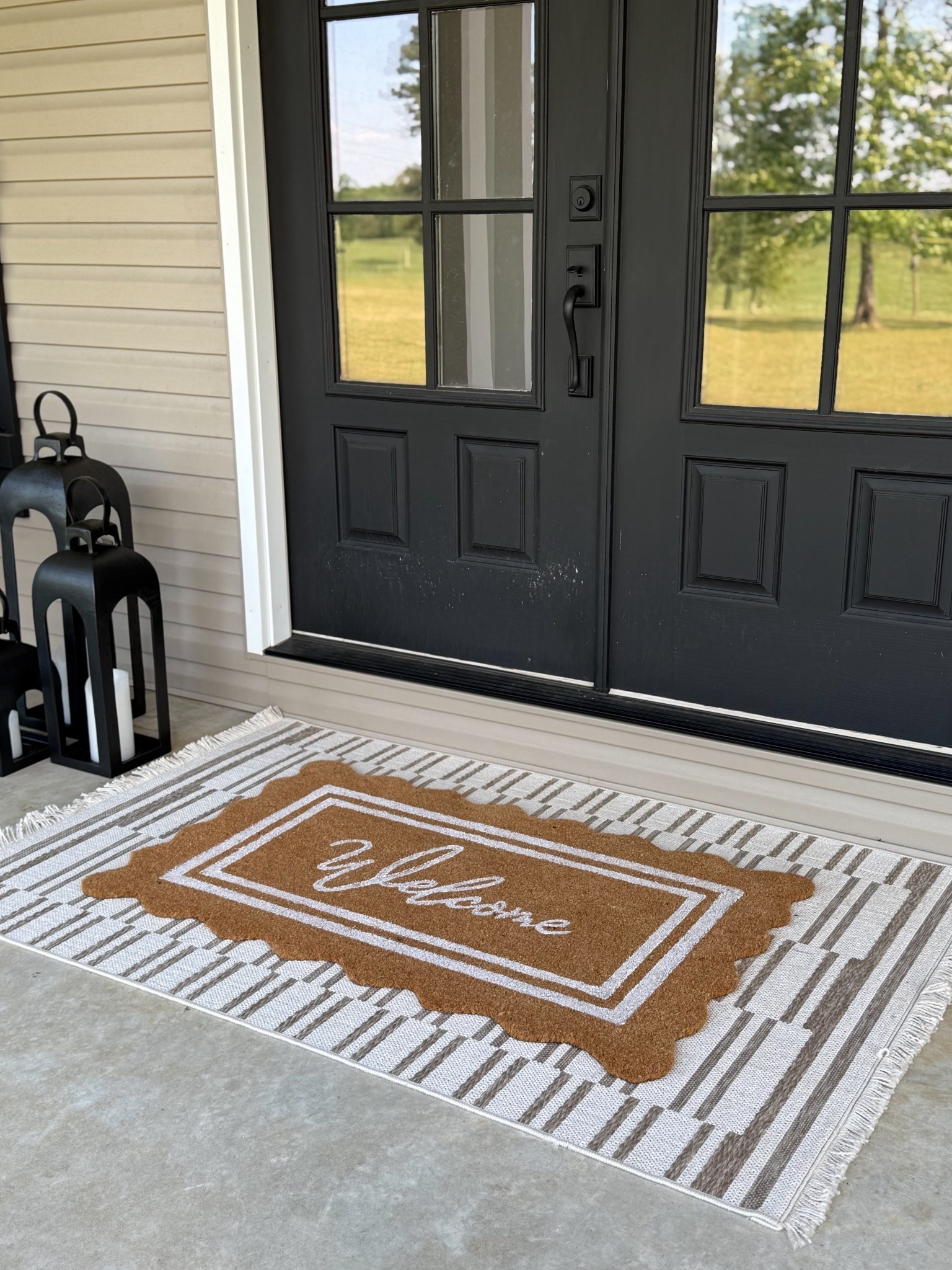 Summer front porch! Love this scalloped door mat from My Texas House at Walmart. Comes in two sizes. I layered it with the Loloi Malibu rug underneath! Love how it pairs with the Target Threshold lanterns. 🖤

#LTKSeasonal #LTKHome #LTKSaleAlert