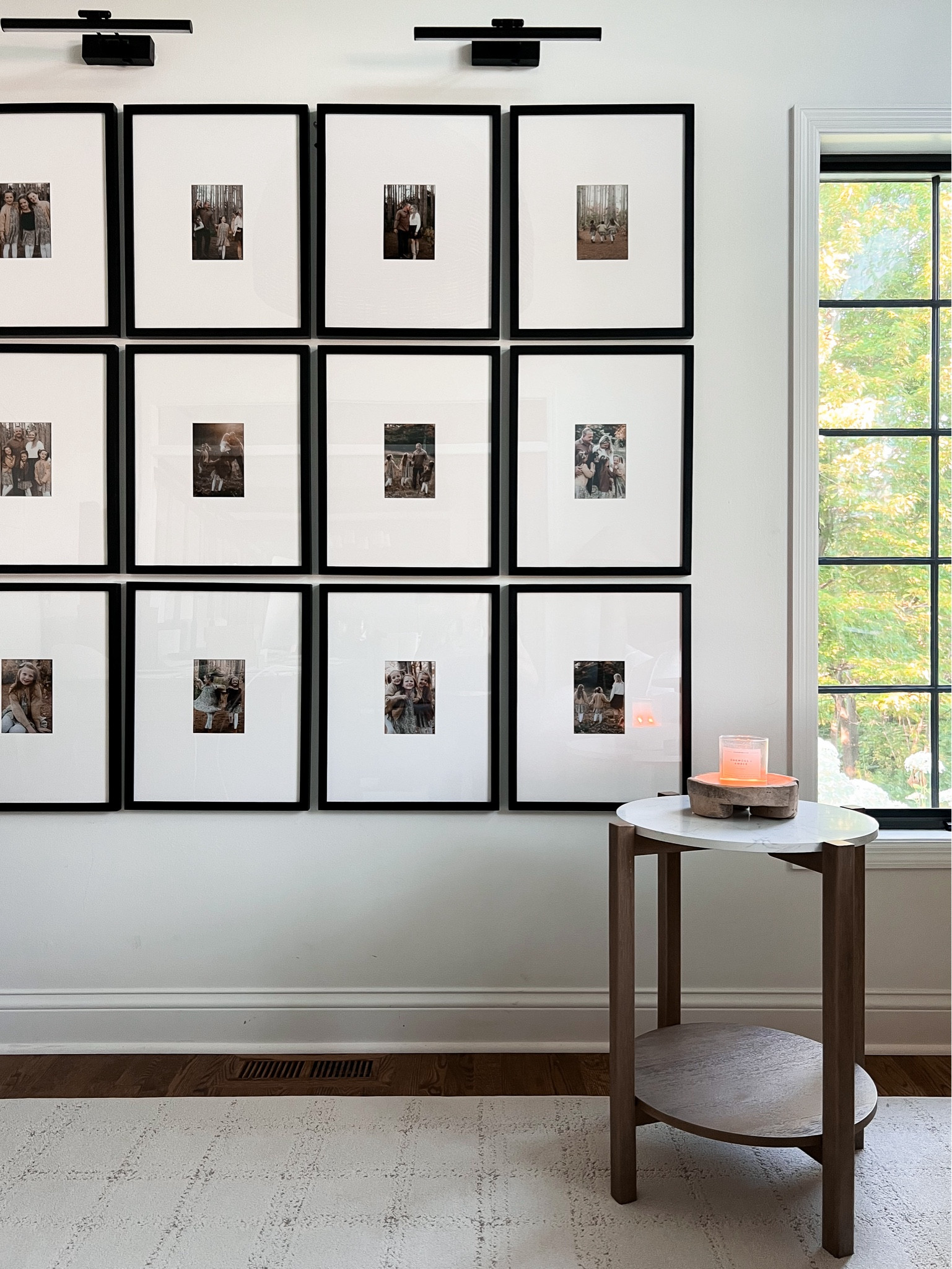 Gallery wall with picture lights above. Our frames are 16x20 with a 5x7 opening. 

#LTKStyleTip #LTKHome #LTKFindsUnder100