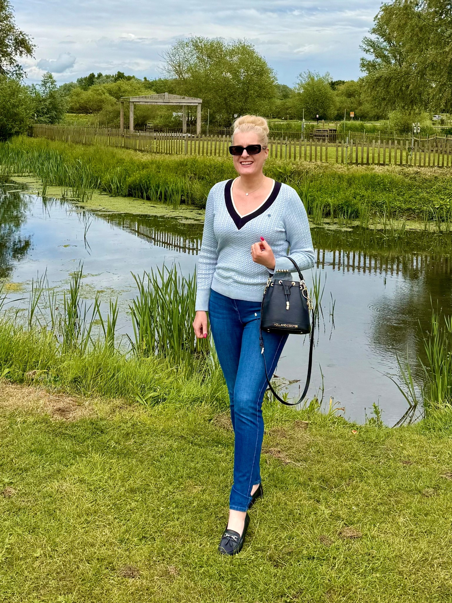Hi everyone! I’m wearing a few new pieces in this outfit. First up is the pale blue thin knit jumper, which is perfect for cooler spring/summer days. The slim line black Paris sunglasses are super chic &amp; go with my new leather bucket bag perfectly. I finally found a comfortable pair of loafer shoes which are such a classic style. This outfit can also be worn in autumn too &amp; such a timeless look. I’ve also added other colours. The bag is available in a rattan, perfect for summer. The sunglasses are also available in tortoiseshell &amp; the top in pink &amp; cream. 
 
U.K. blogger, British luxe, Holland cooper, Amazon, purse, luxury, tall, midsize, size 14/16. 



#LTKshoes #LTKuk #LTKbag