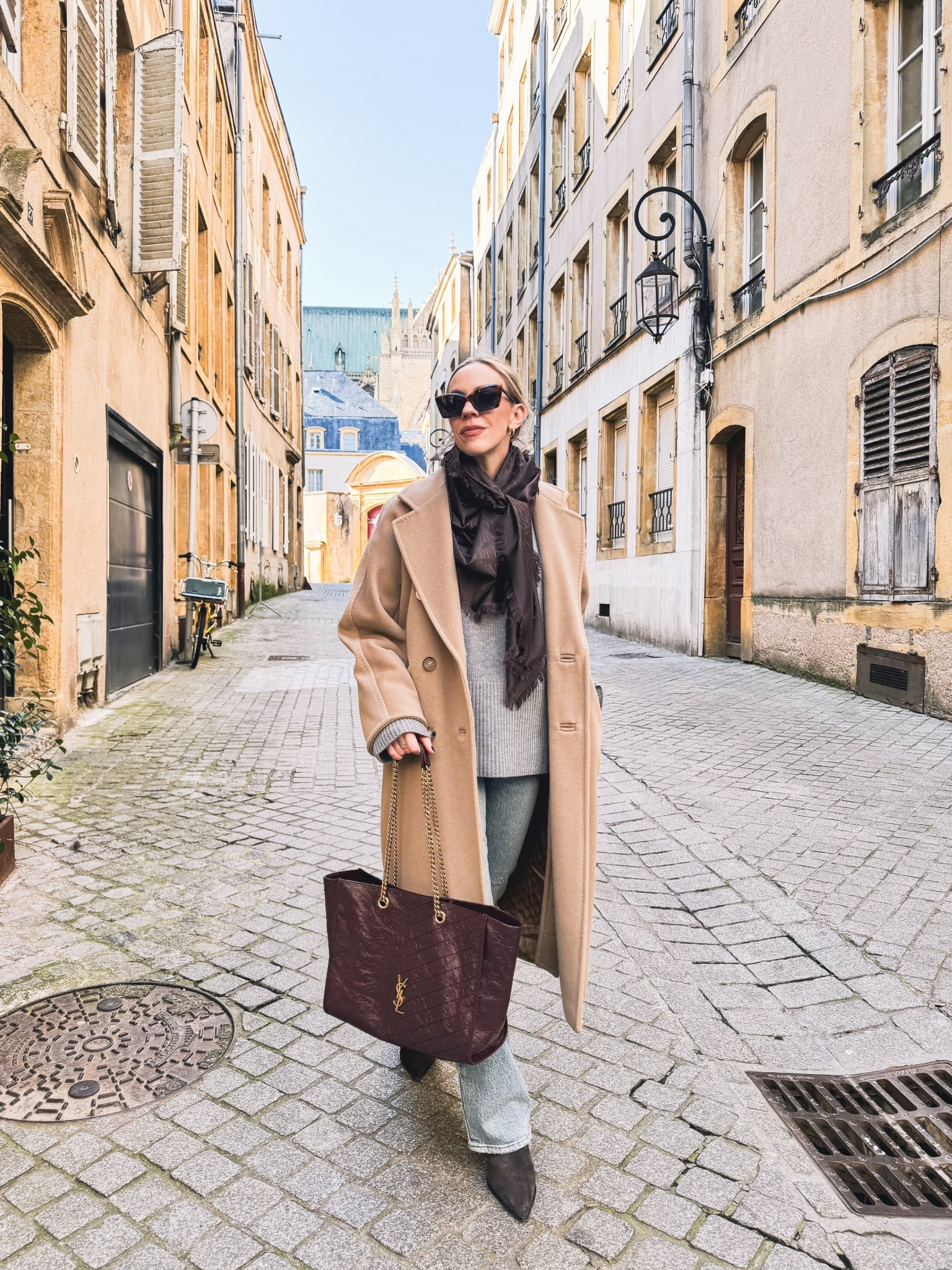 Camel coat outfit, European vacation look, brown YSL scarf, @Levi's bootcut jeans, burgundy YSL tote bag

#LTKOver40 #LTKTravel #LTKSeasonal