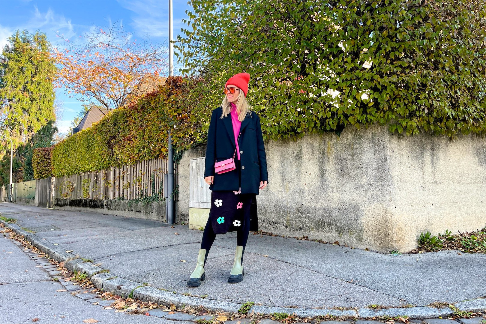 Floral Knit Dress. Fashion Blogger Girl by Style Blog Heartfelt Hunt. Girl with blond hair wearing a floral knit dress, orange beanie, orange sunglasses, oversized blazer, pink sweater, pink mini bag ans green chunky boots. #colorfuloutfit #colorfulstyle #colorfulfashion #colorfullooks #fashionfun #cutefalloutfit #fallfashion2022 #falllookbook #fitcheck #dailylooks #dailylookbook #contentcreator #microinfluencer #discoverunder20k