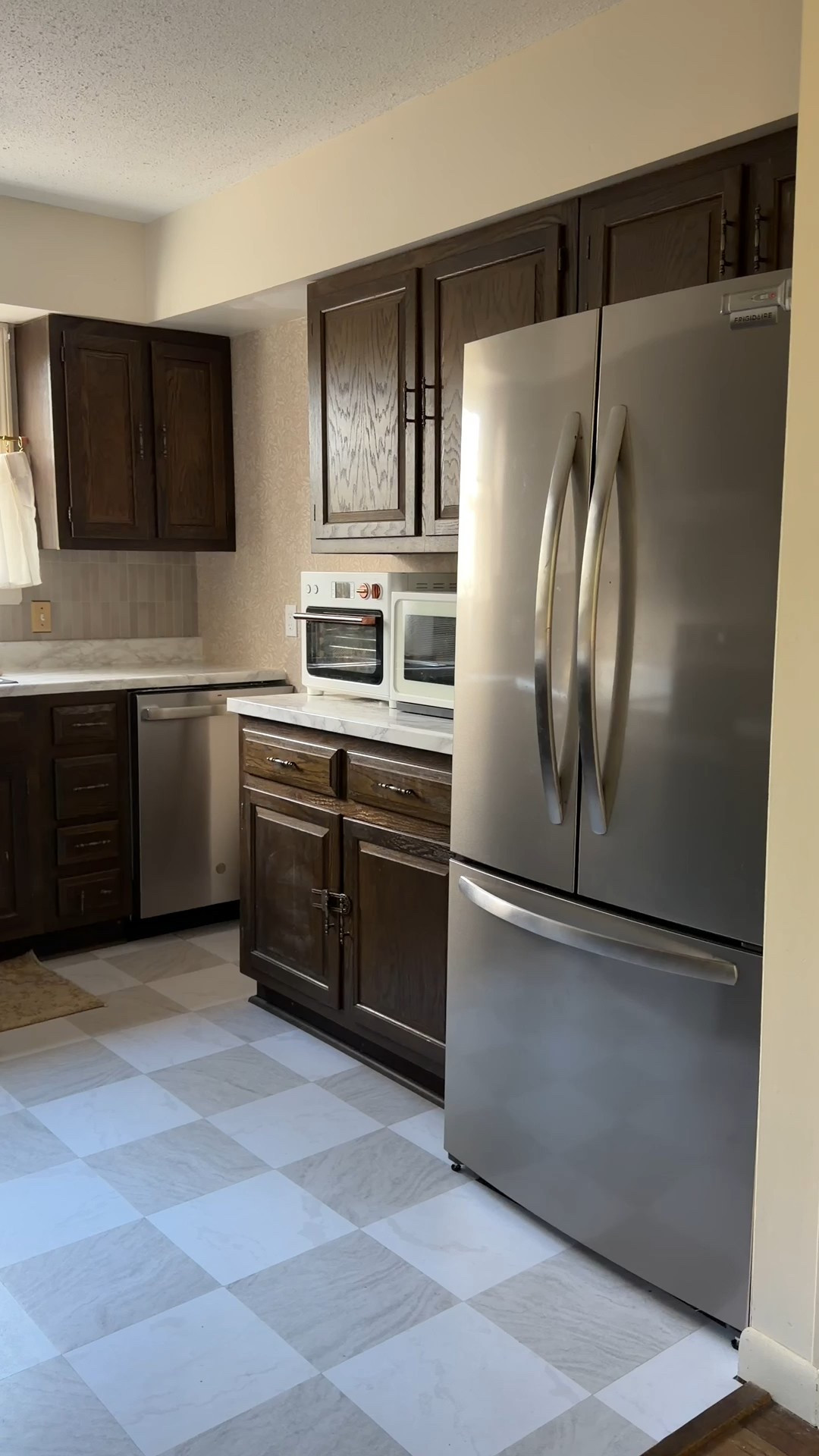 Despite not being able to fully renovate this year - we were still able to update the kitchen at the cabin in a way that cbs hold us over until we can fully renovate! We used peel and stick tiles on the floors, marble contact paper on the countertops, peel and stick wallpaper, and peel and stick tiles as the backsplash. We also replaced all appliances, swapped out the faucet, replaced the ceiling light fixtures, added a cute cafe curtain in the window, and replaced the outlet covers and light switch covers! 

#LTKHome