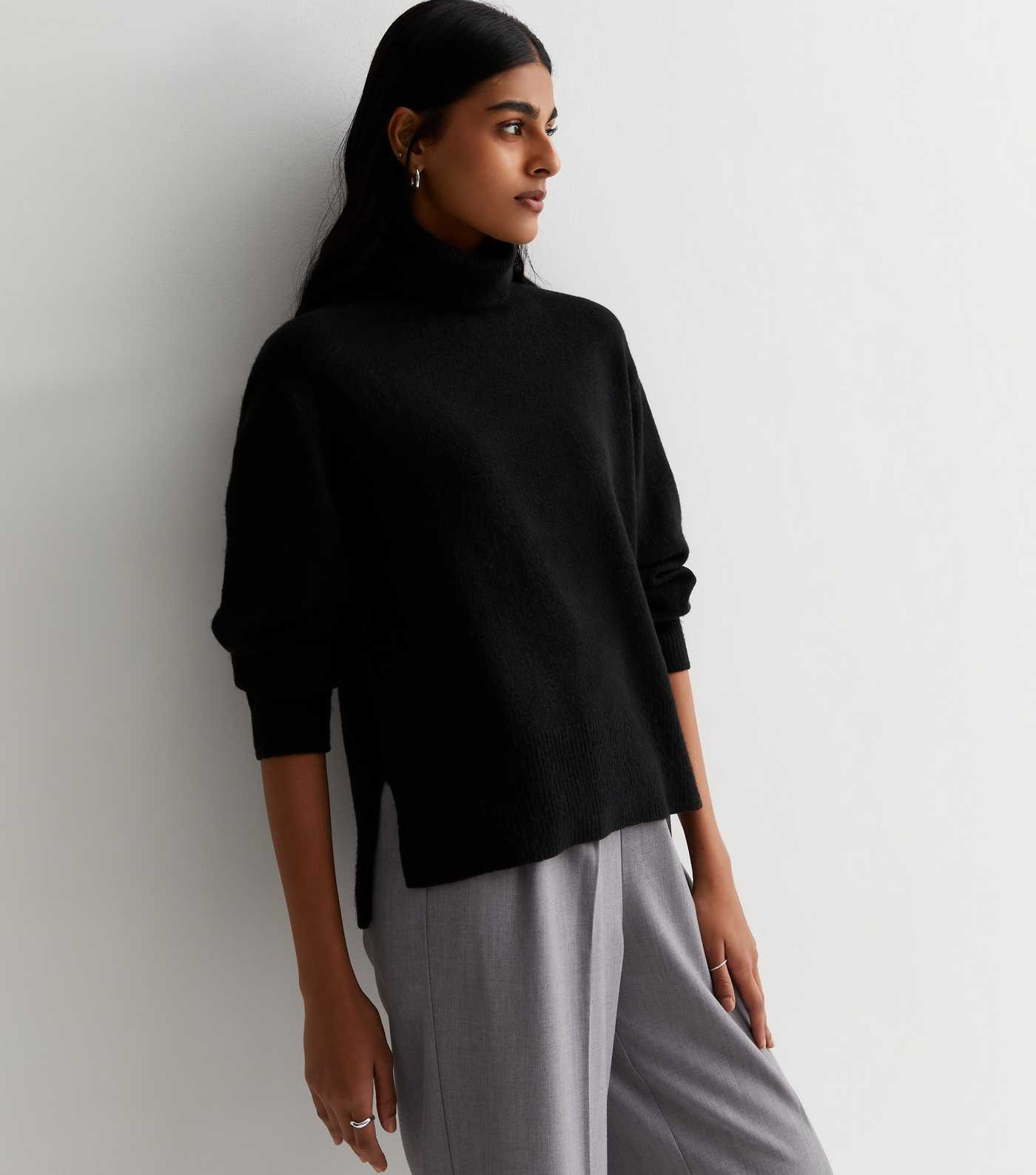 Black Knit Roll Neck Split Hem Jumper
						
						Add to Saved Items
						Remove from Saved Ite... | New Look (UK)