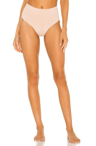 SPANX Everyday Shaping Panties Thong in Toasted Oatmeal from Revolve.com | Revolve Clothing (Global)