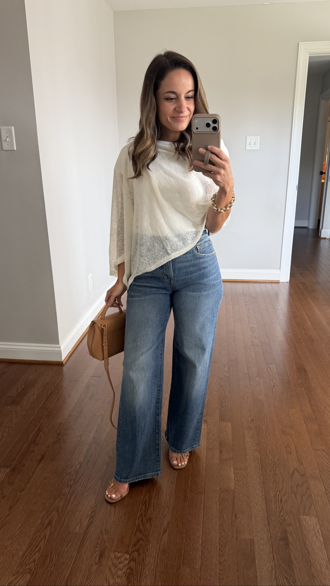 Another great pair of jeans on sale this weekend! If you’re looking for jeans that hold their shape well through wear I highly recommend Madewell jeans. Of all of my brand I feel like these keep their shape the best. 

Madewell Perfect Vintage Wide Leg: petite 24 - 10 3/8” rise 28” inseam 

Summer 
T-shirt (Old Navy): xs 
Poncho (Free People) 
Bag (Polene Un Nano) 

Transitional outfits / early fall outfits / petite jeans

#LTKPetite
