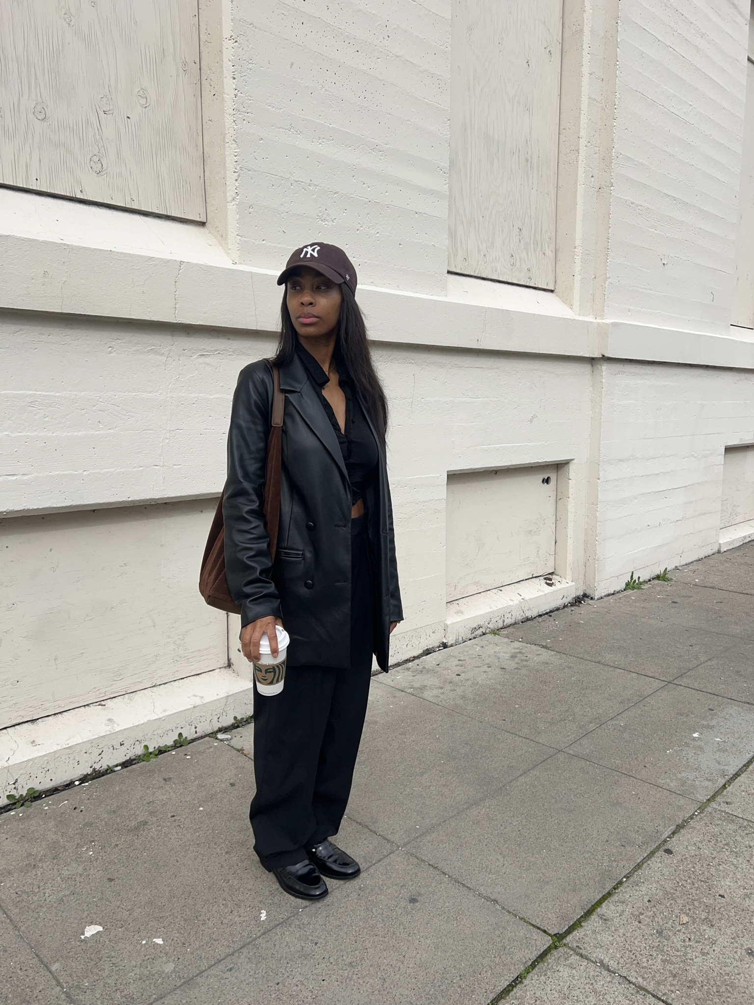 black pleather jacket, black button up, black pants, black loafers, suede brown bag, and brown hat. 

#LTKstyletip