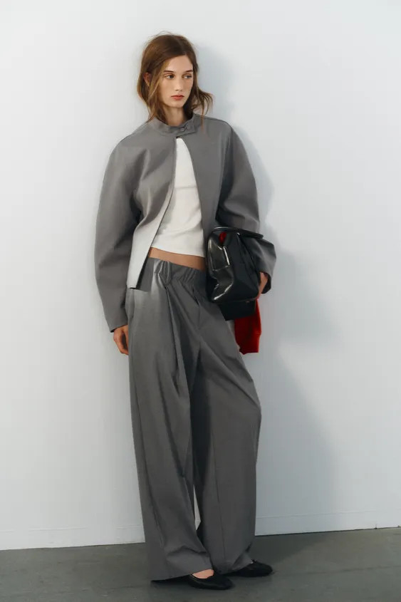 Fitted jacket with a high collar and long voluminous sleeves. Tonal lining. Zip-up and snap butto... | Zara IT
