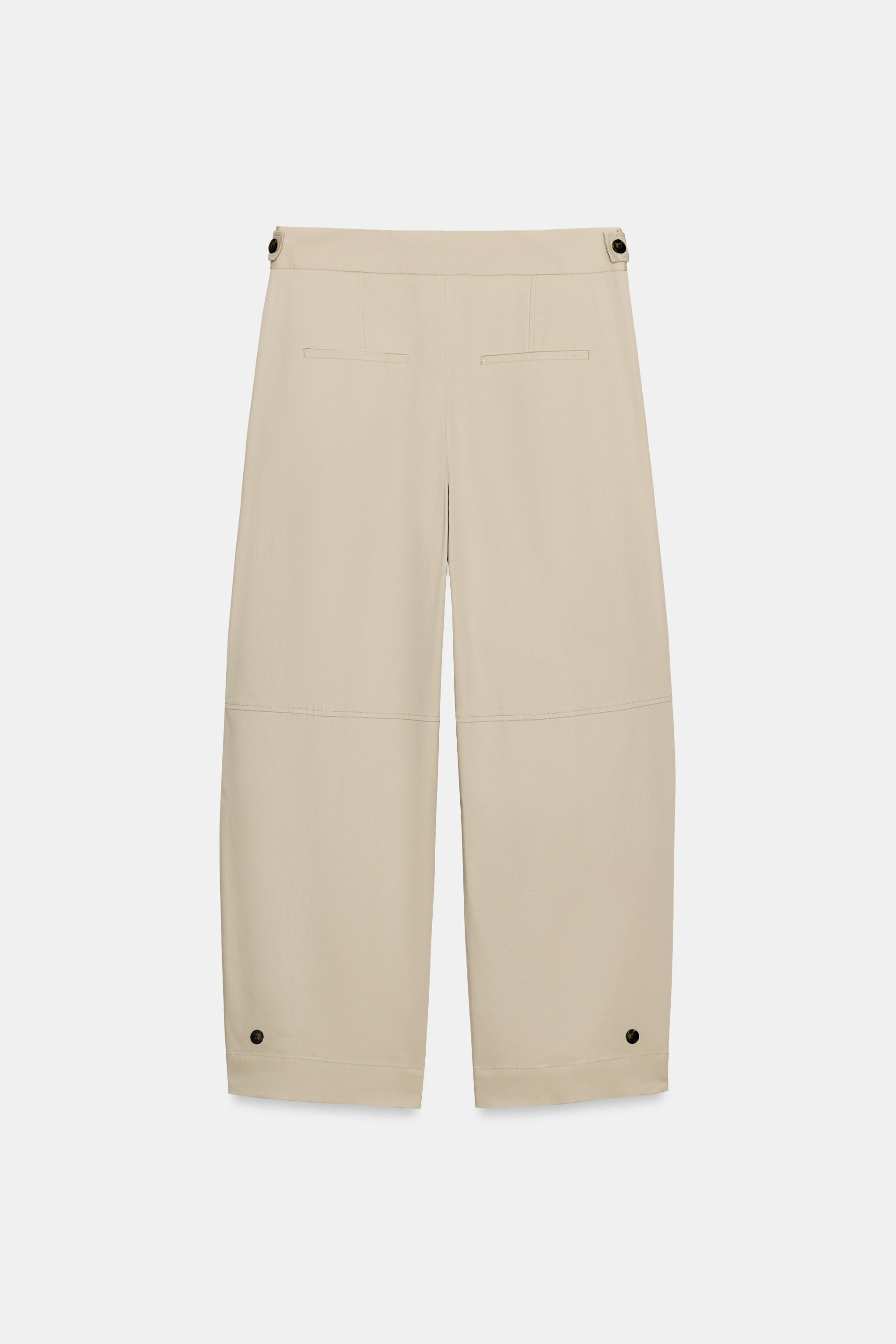 High-waist trousers with front welt pockets and false flap pockets at the back. Featuring a wide-... | Zara UK