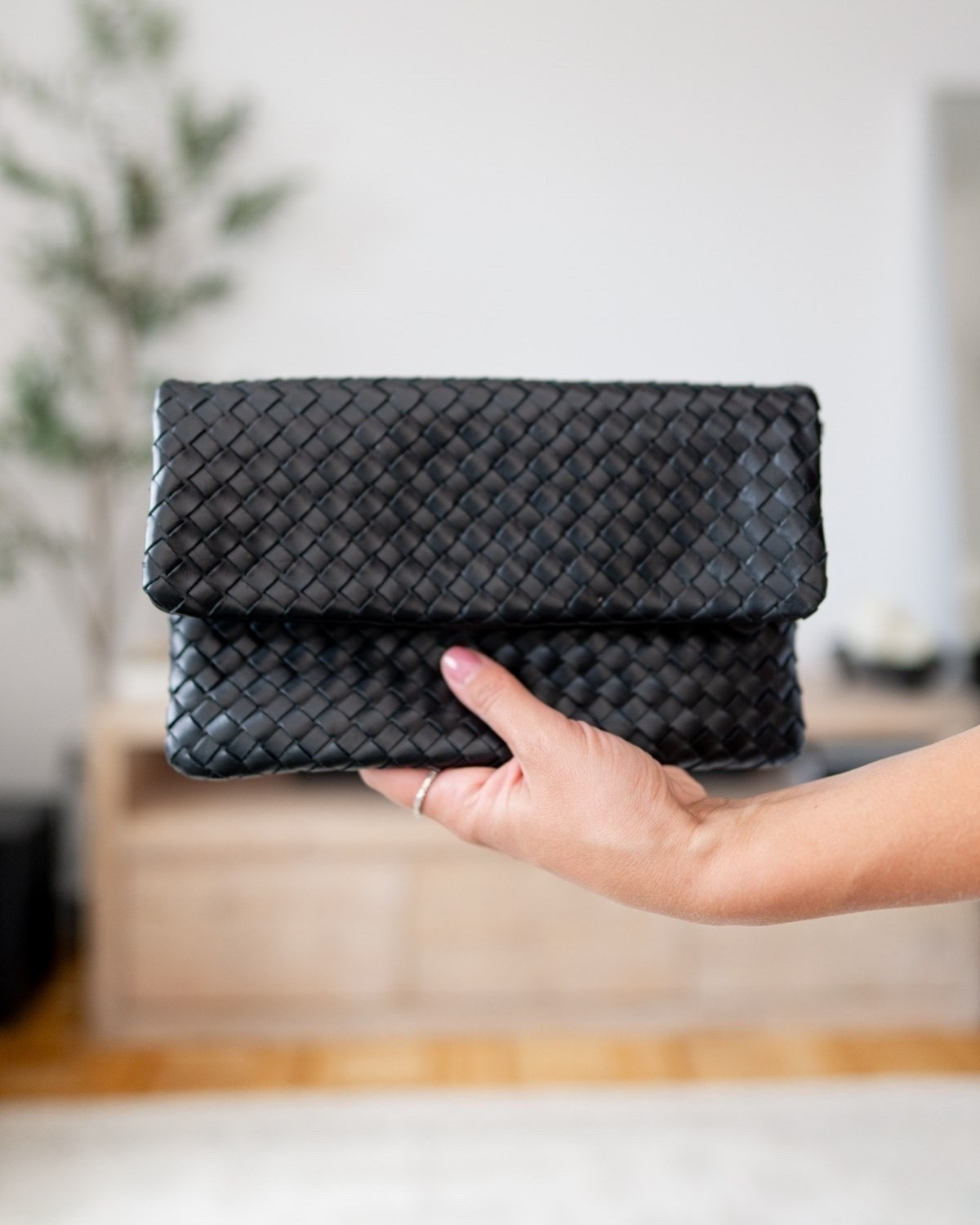 A chic Quince woven clutch that adds effortless polish to any outfit. The classic black color and woven texture make it an easy staple for dinners, weddings, date nights, and beyond.

Quince clutch, Quince handbag, woven clutch, black purse, evening bag, date night bag, wedding guest accessories, classic handbag

#LTKWorkwear #LTKgrwm #LTKootd