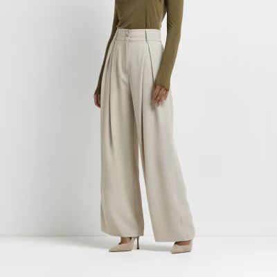 Beige wide leg pleated trousers | River Island (UK & IE)