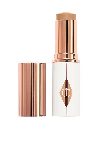 Charlotte Tilbury Unreal Skin Sheer Glow Tint Hydrating Foundation Stick in 7.5 Medium. | Revolve Clothing (Global)